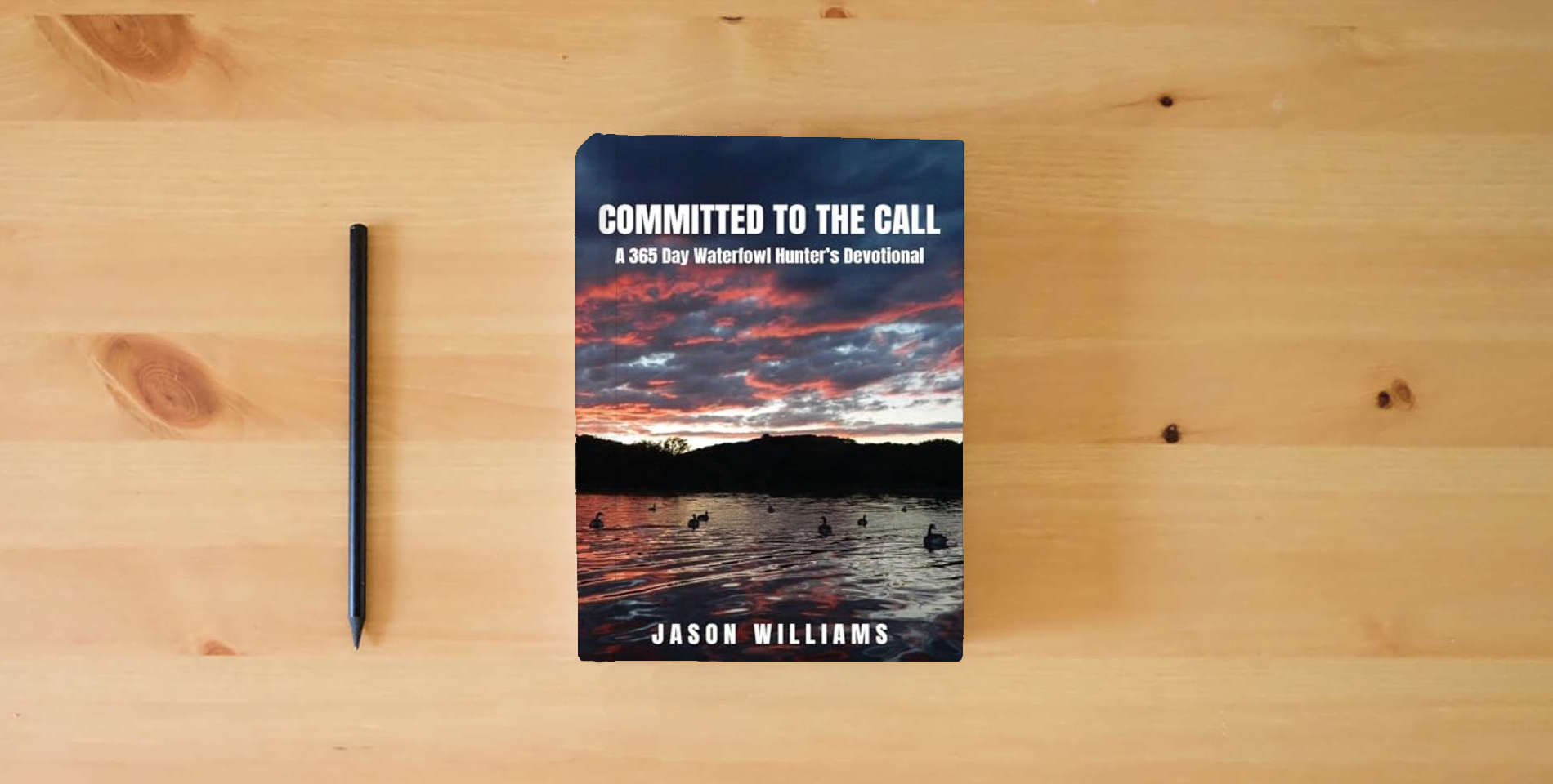 The book Committed to the Call: A 365 Day Waterfowl Hunter's Devotional is on the table