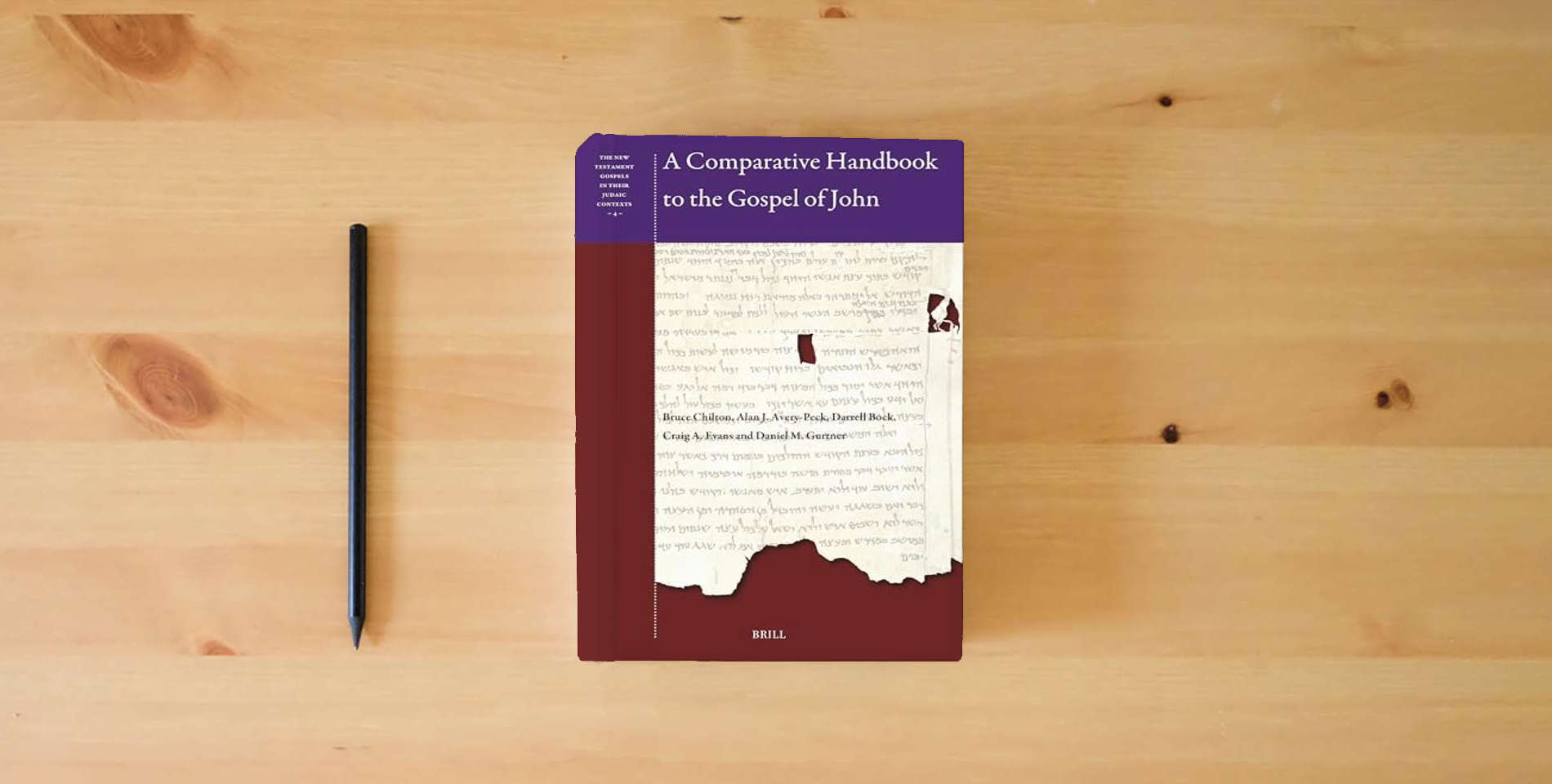 The book A Comparative Handbook to the Gospel of John (The New Testament Gospels in their Judaic Contexts, 4) is on the table