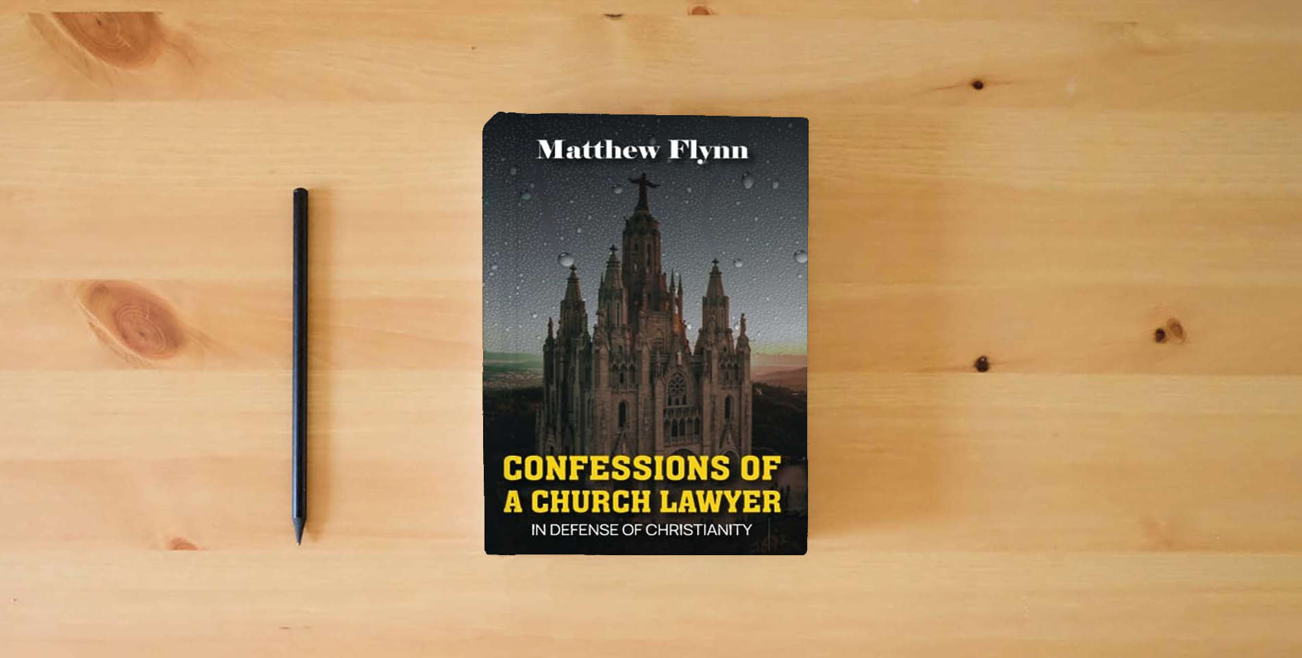 The book CONFESSIONS OF A CHURCH LAWYER: IN DEFENSE OF CHRISTIANITY is on the table