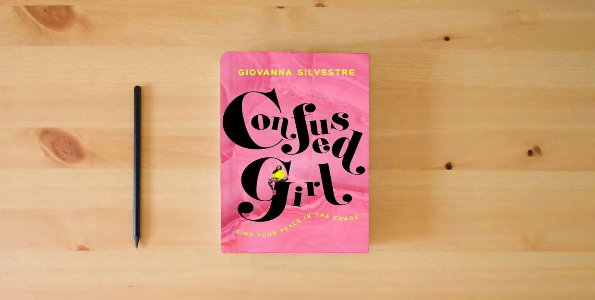 The book Confused Girl: Find Your Peace in the Chaos is on the table