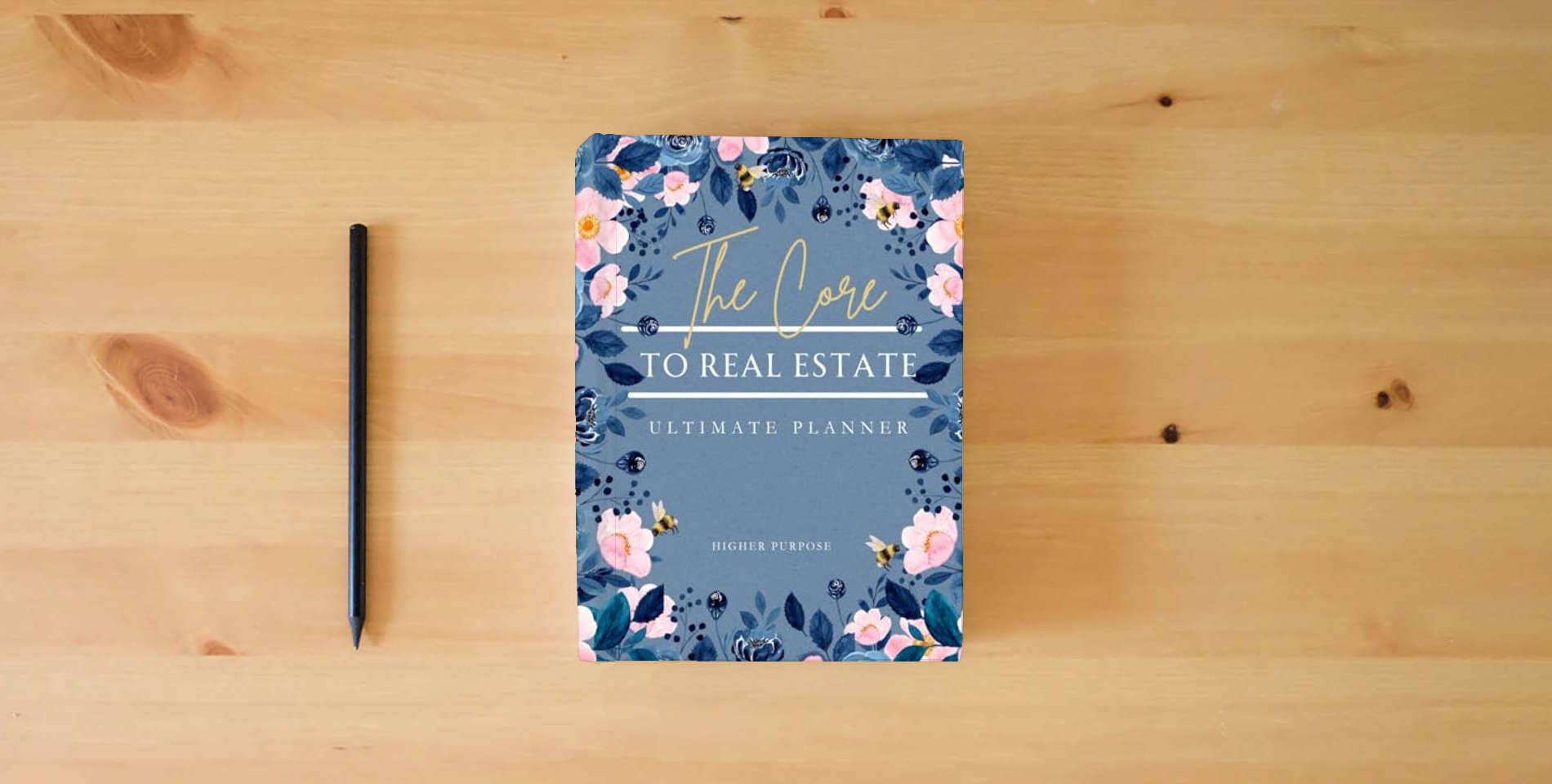 The book Core to Real Estate Planner: Ultimate Organizer Designed for Christian Realtors is on the table