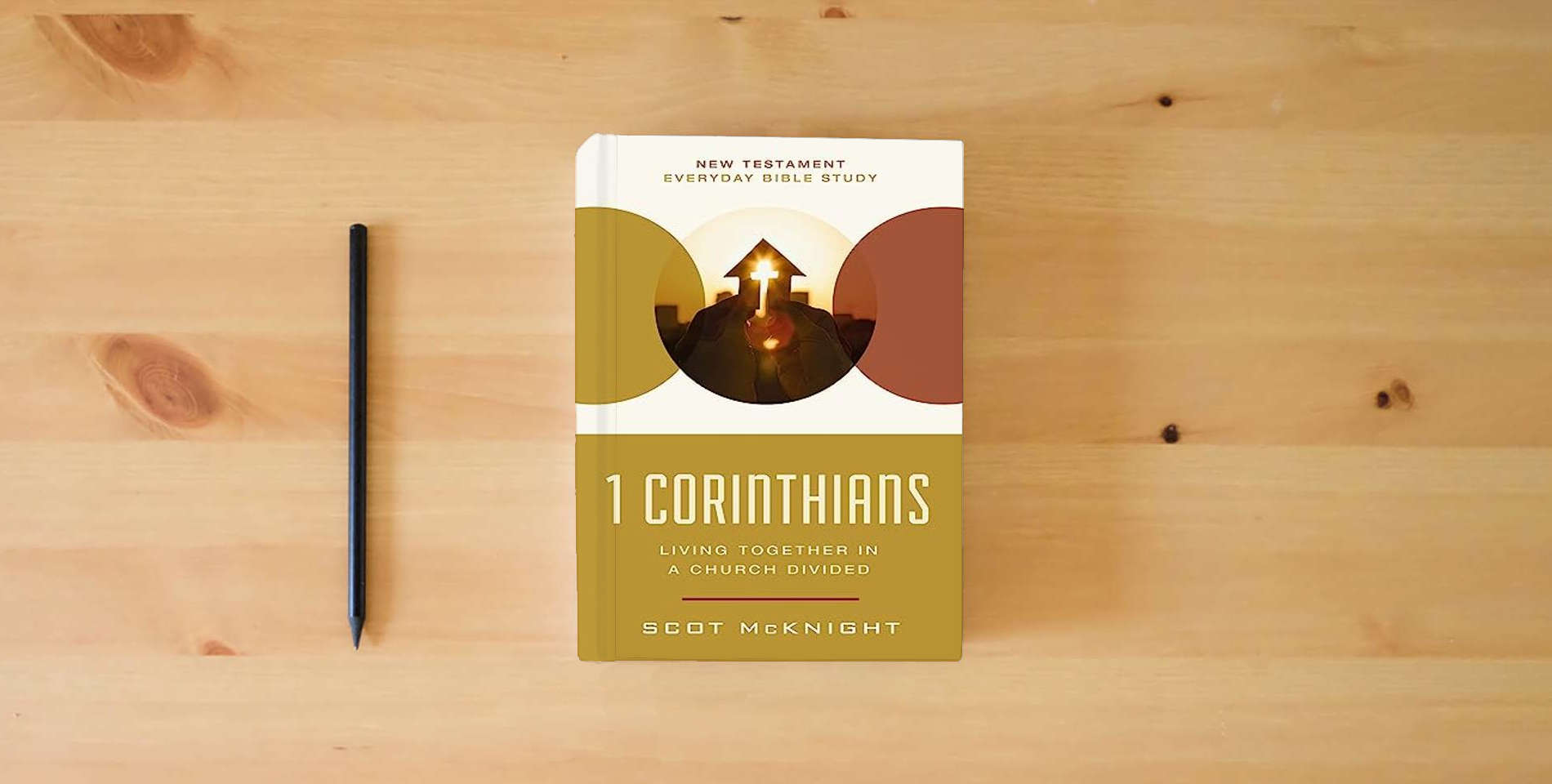 The book 1 Corinthians: Living Together in a Church Divided (New Testament Everyday Bible Study Series) is on the table