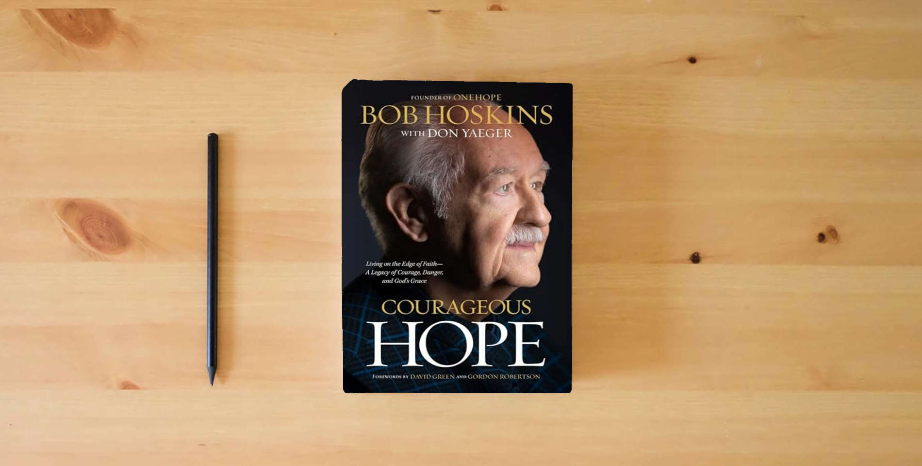 The book Courageous Hope: Living on the Edge of Faith ― A Legacy of Courage, Danger, and God’s Grace is on the table
