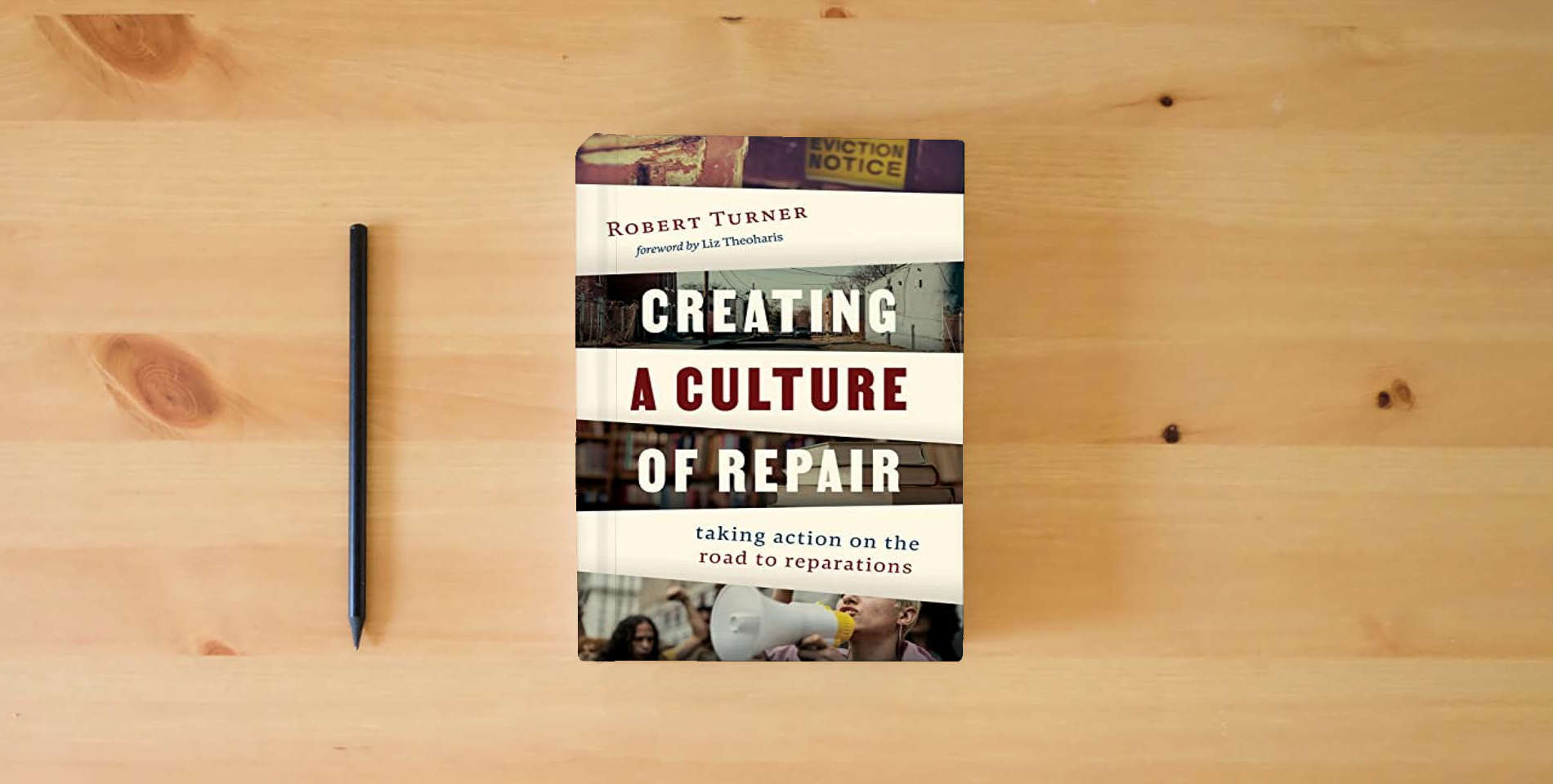 The book Creating a Culture of Repair: Taking Action on the Road to Reparations is on the table