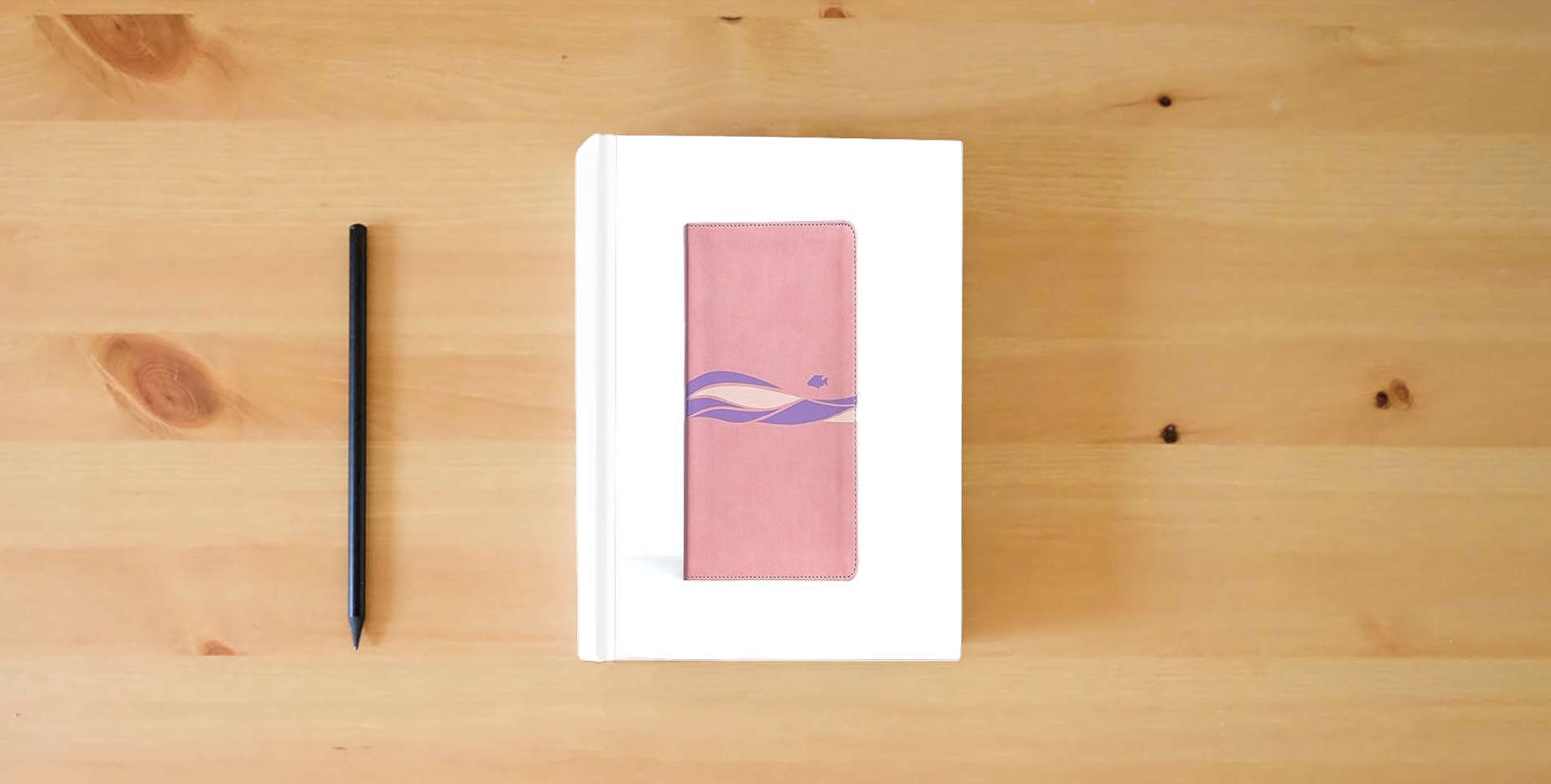 The book CSB Easy-for-Me Bible for Early Readers, Coral Pink LeatherTouch, Presentation Page, Highlighted Memory Verses, Learning Helps, Games, Reading Challenges, Easy-to-Read Bible Serif Type is on the table