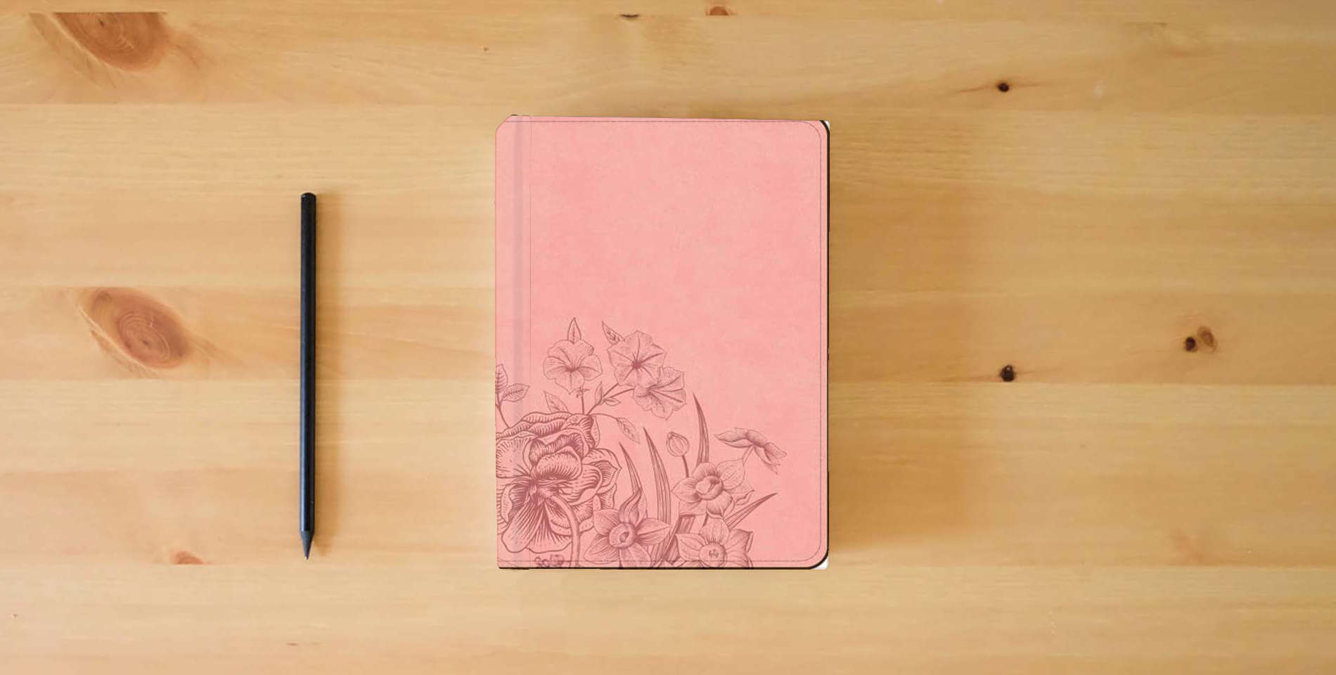 The book CSB Large Print Compact Reference Bible, Optimal Type, Digital Study Edition, Pink Floral LeatherTouch Red Letter, Presentation Page, Cross-References, Full-Color Maps is on the table