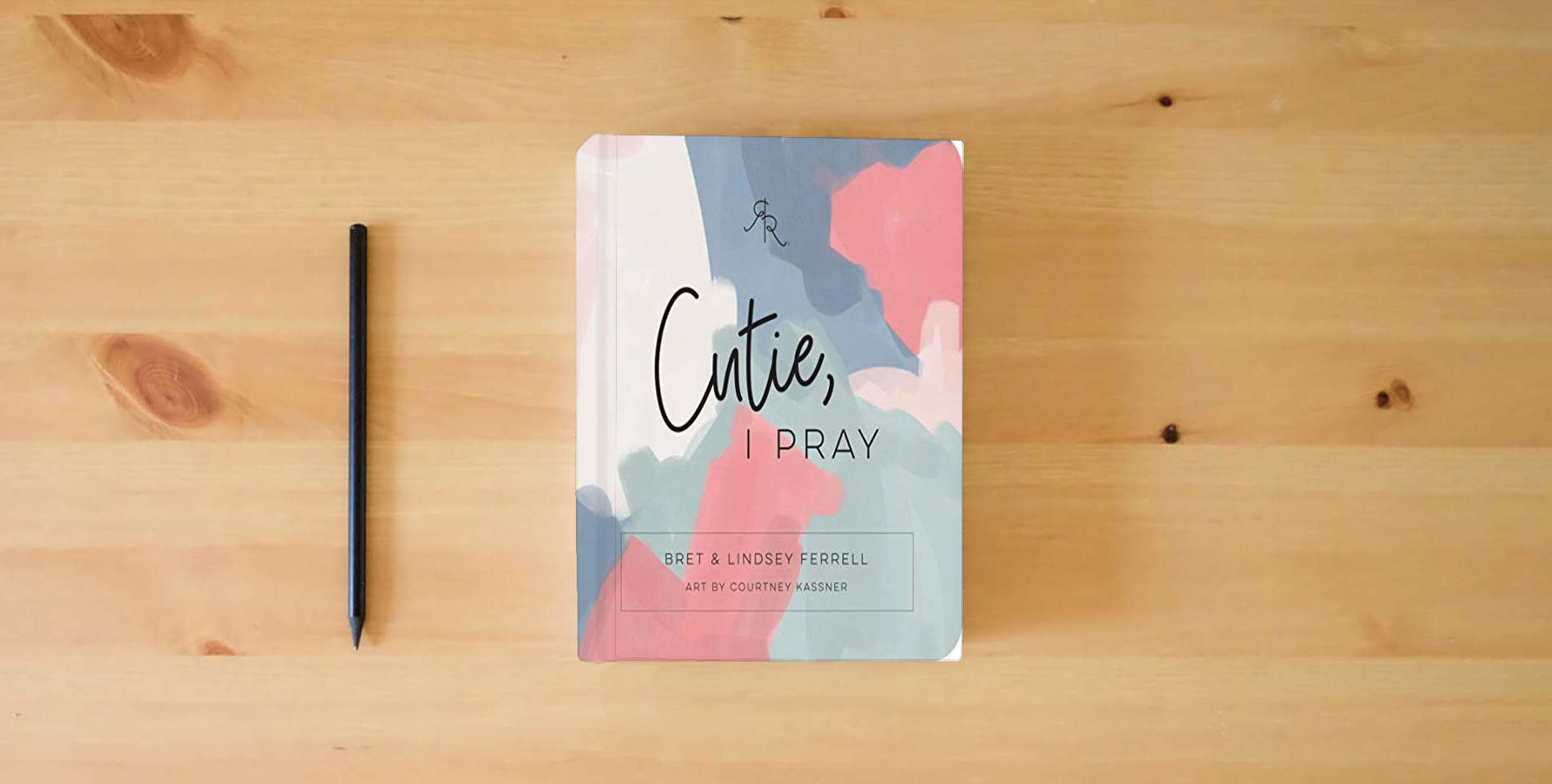 The book Cutie, I Pray (Ryan & Rose) is on the table
