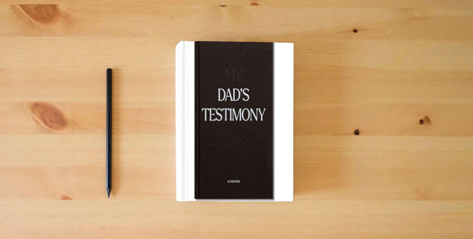 The book My Dad's Testimony: A Guided Journal For Sharing His Beautiful Story (HC) is on the table