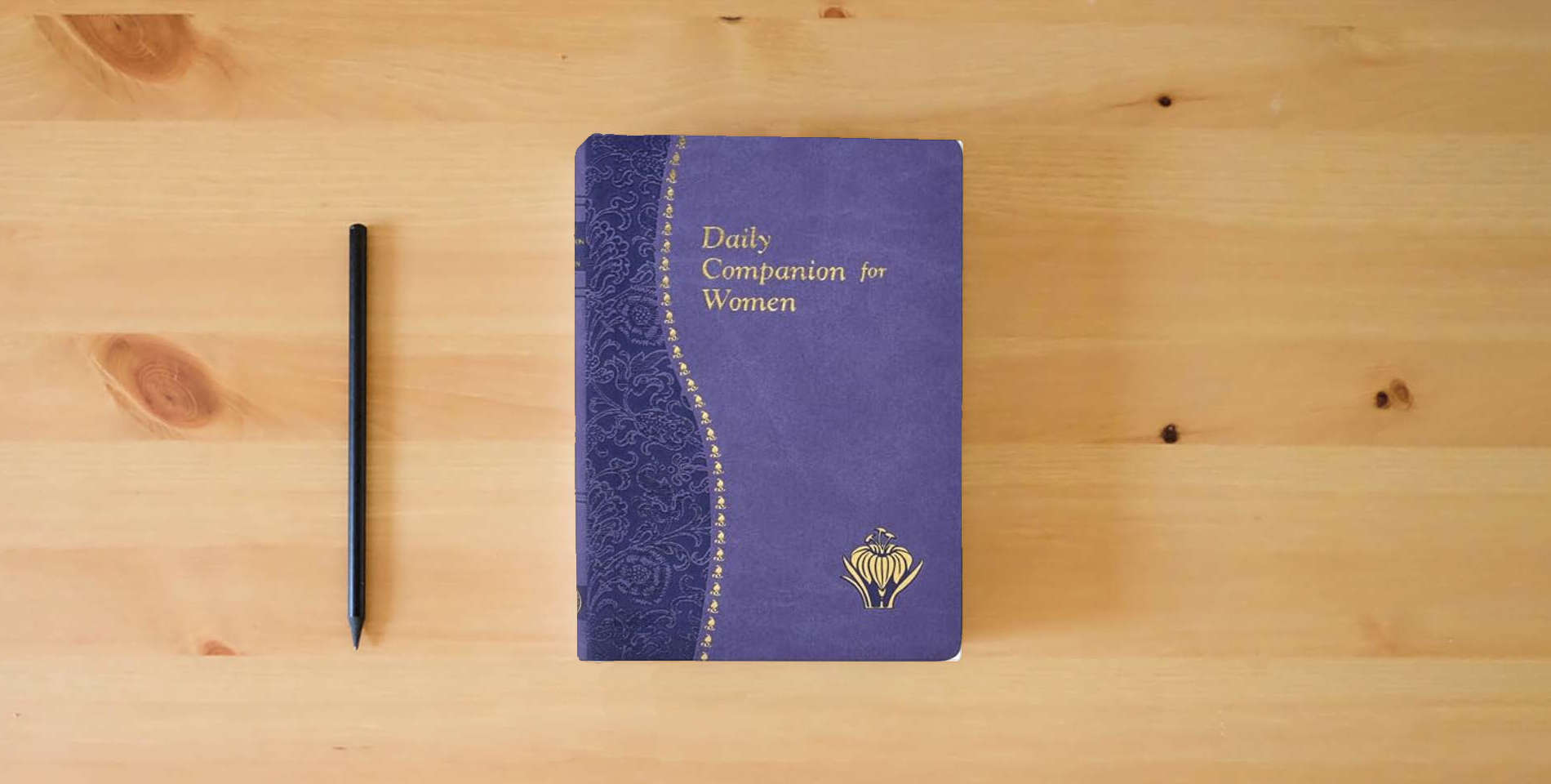 The book Daily Companion for Women [Imitation Leather] Kelly-Gangi, Carol (Catholic Daily Devotionals) is on the table