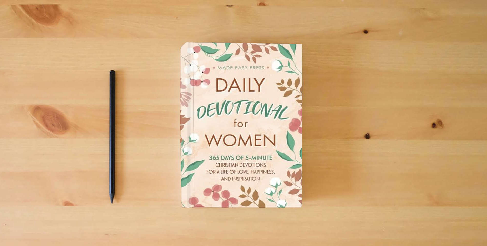 The book Daily Devotional for Women: 365 Days of 5-Minute Christian Devotions for a Life of Love, Happiness, and Inspiration (Best Wholesome Christian Gift ... Easter or Christmas Present 2024-2025) is on the table