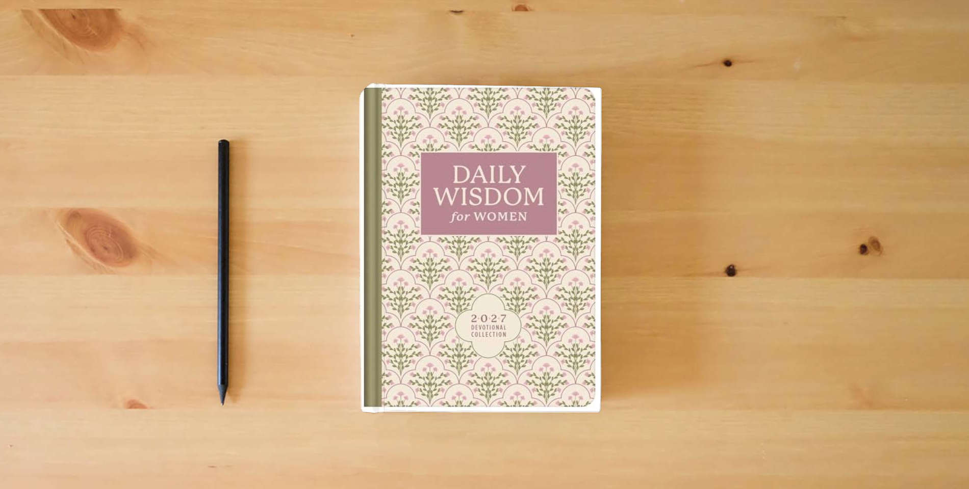 The book Daily Wisdom for Women 2027 Devotional Collection (Daily Wisdom - Annual Edition) is on the table