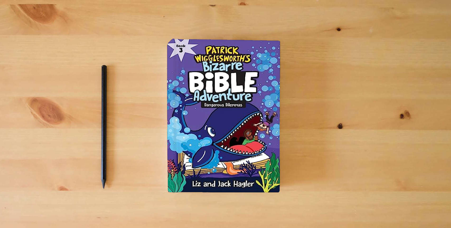 The book Dangerous Dilemmas (Patrick Wigglesworth’s Bizarre Bible Adventure) is on the table
