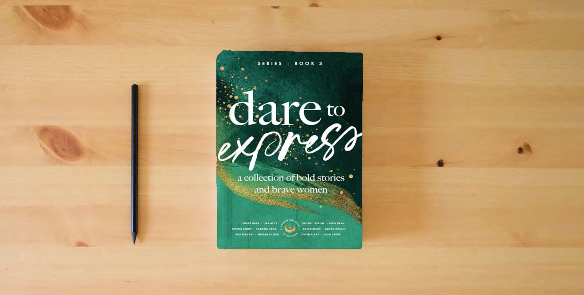 The book Dare to Express: Book 3: A Collection of Bold Stories and Brave Women is on the table