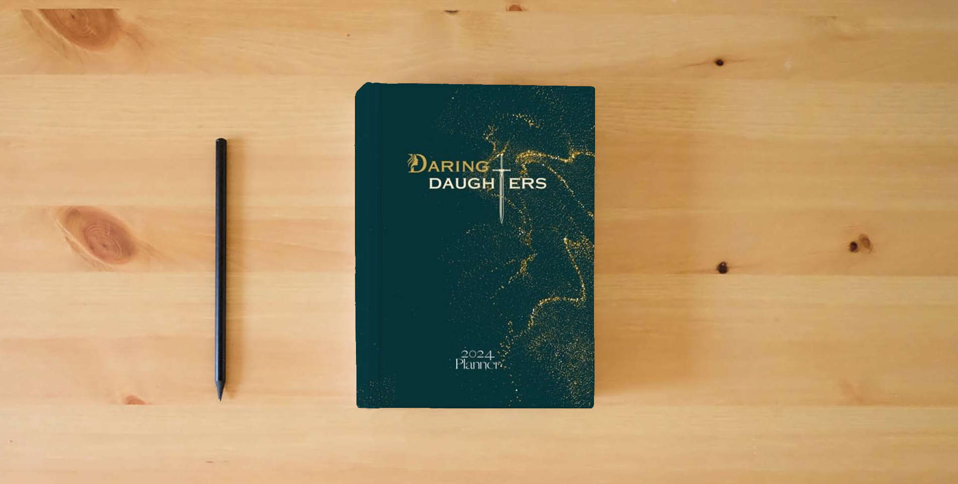 The book Daring Daughter Planner 2024 is on the table