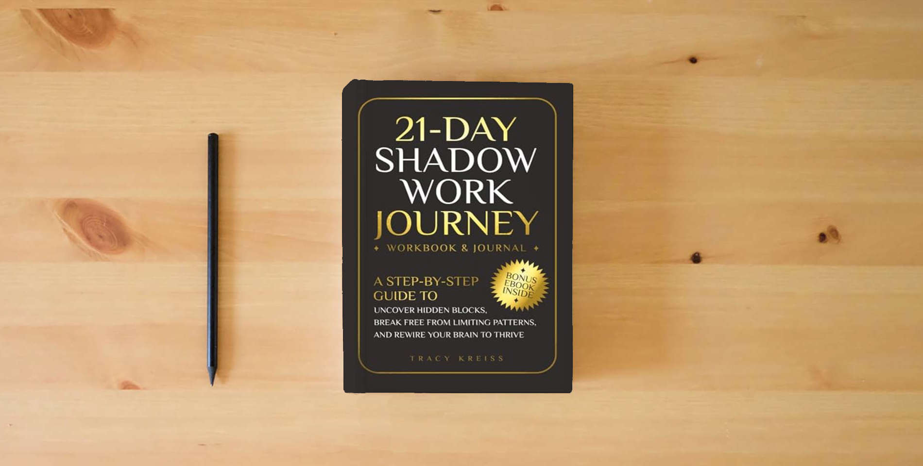 The book 21-Day Shadow Work Journey: A Step-by-Step Guide to Uncover Hidden Blocks, Break Free From Limiting Patterns, and Rewire Your Brain to Thrive is on the table