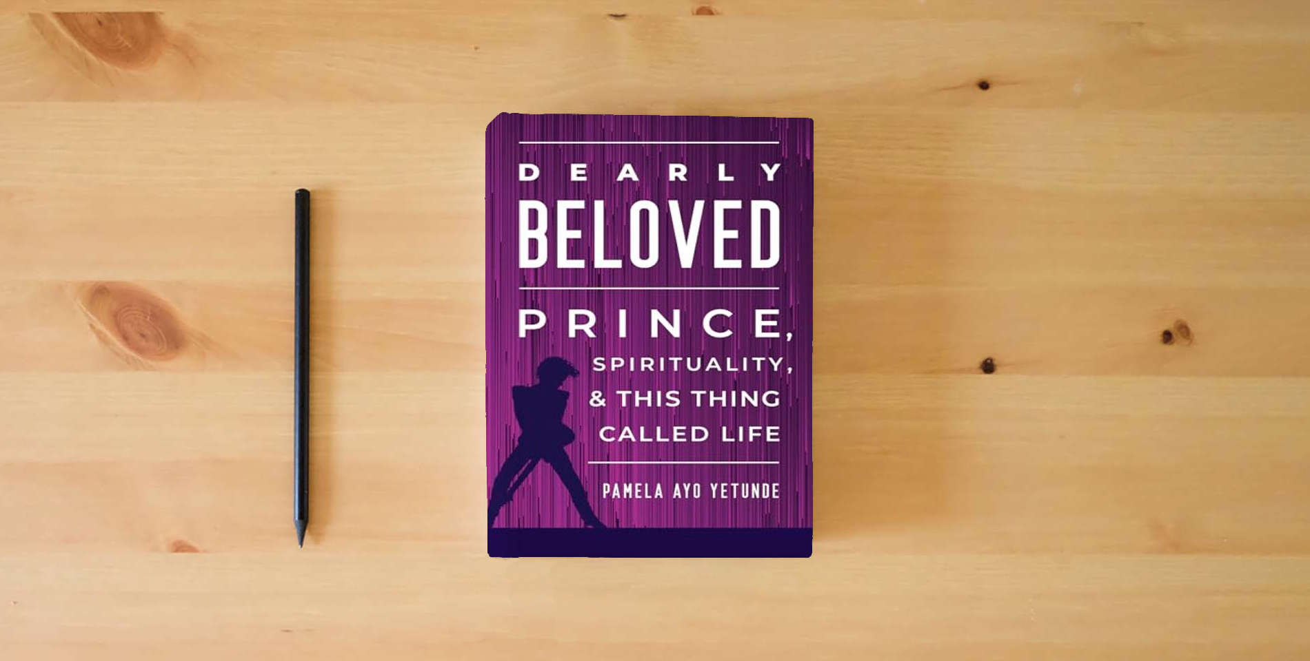 The book Dearly Beloved: Prince, Spirituality, and This Thing Called Life is on the table