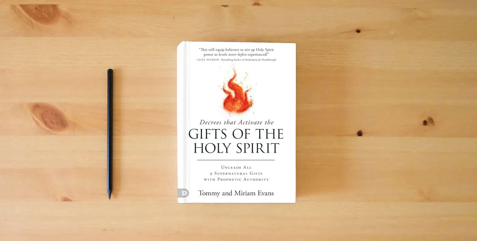 The book Decrees That Activate the Gifts of the Holy Spirit is on the table