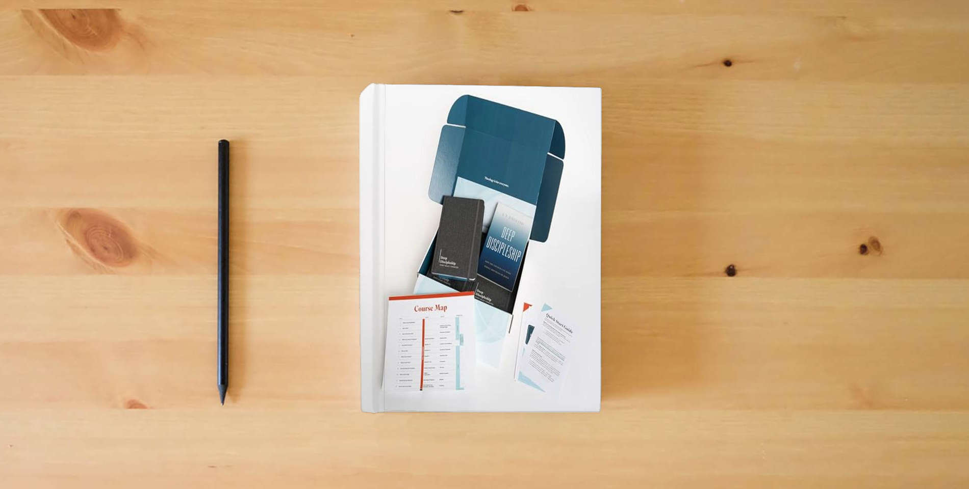 The book Deep Discipleship - Group Starter Kit: Story l Belief l Formation is on the table