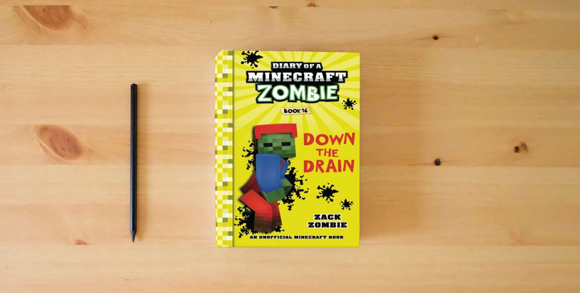 The book Diary of a Minecraft Zombie Book 16: Down The Drain is on the table