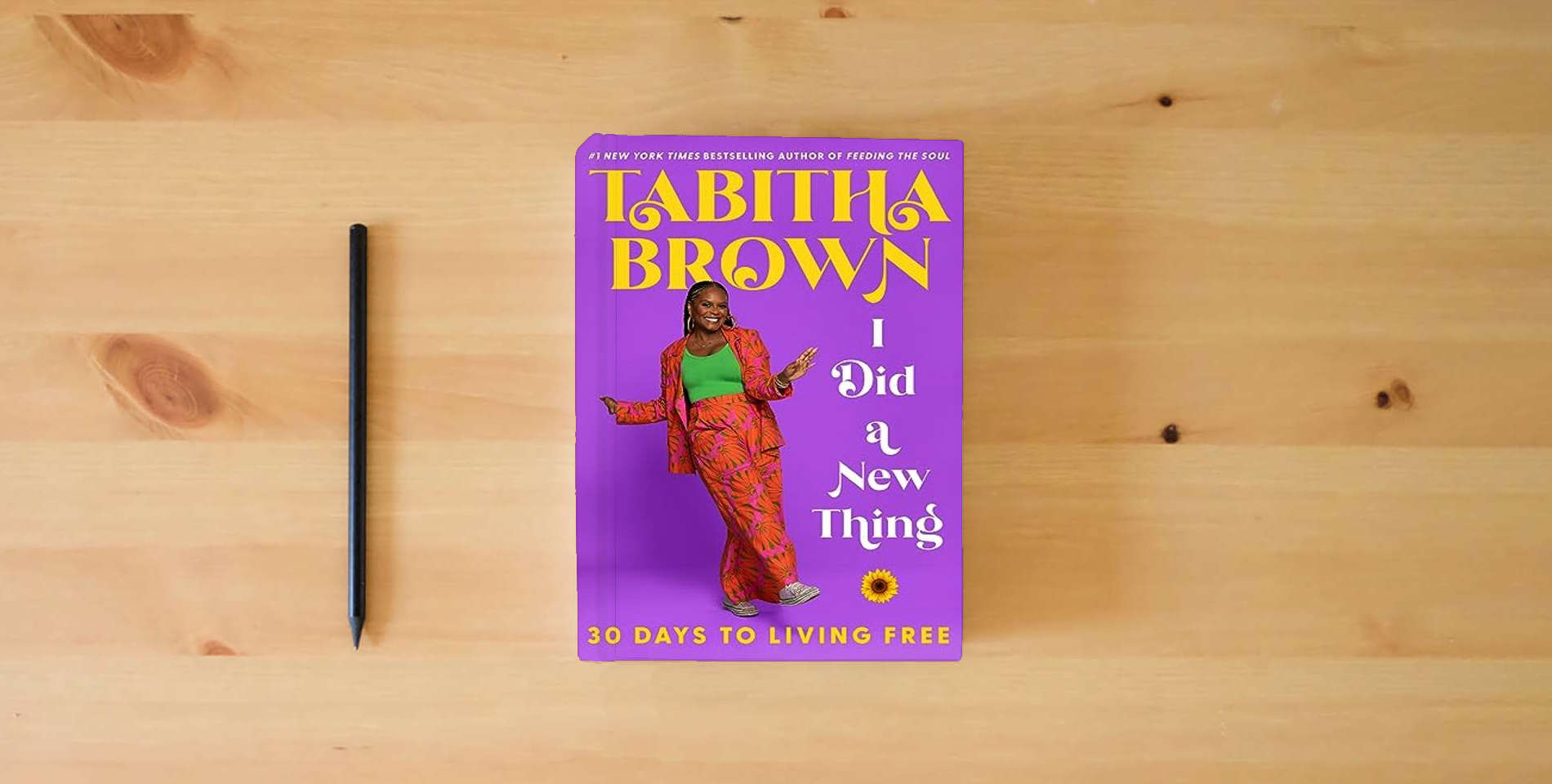 The book I Did a New Thing: 30 Days to Living Free (A Feeding the Soul Book) is on the table