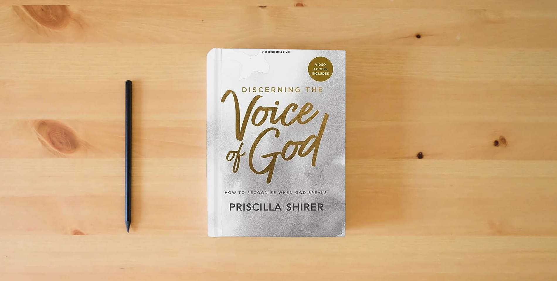 The book Discerning the Voice of God - Bible Study Book with Video Access is on the table