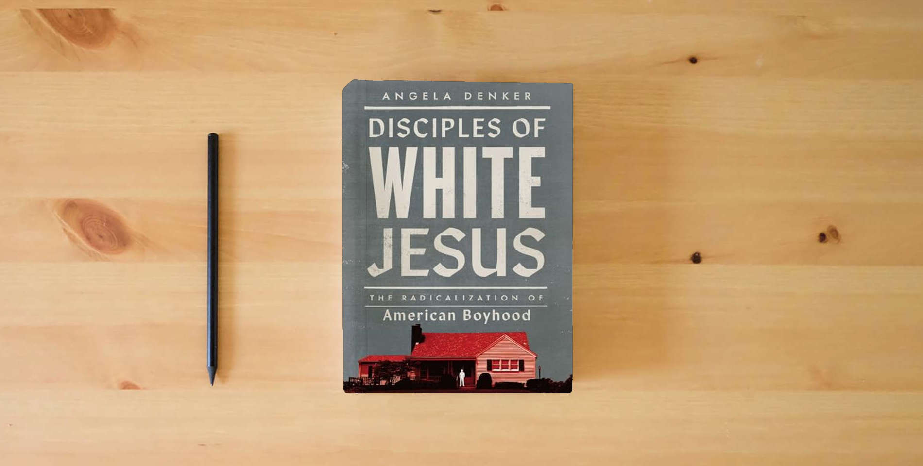 The book Disciples of White Jesus: The Radicalization of American Boyhood is on the table