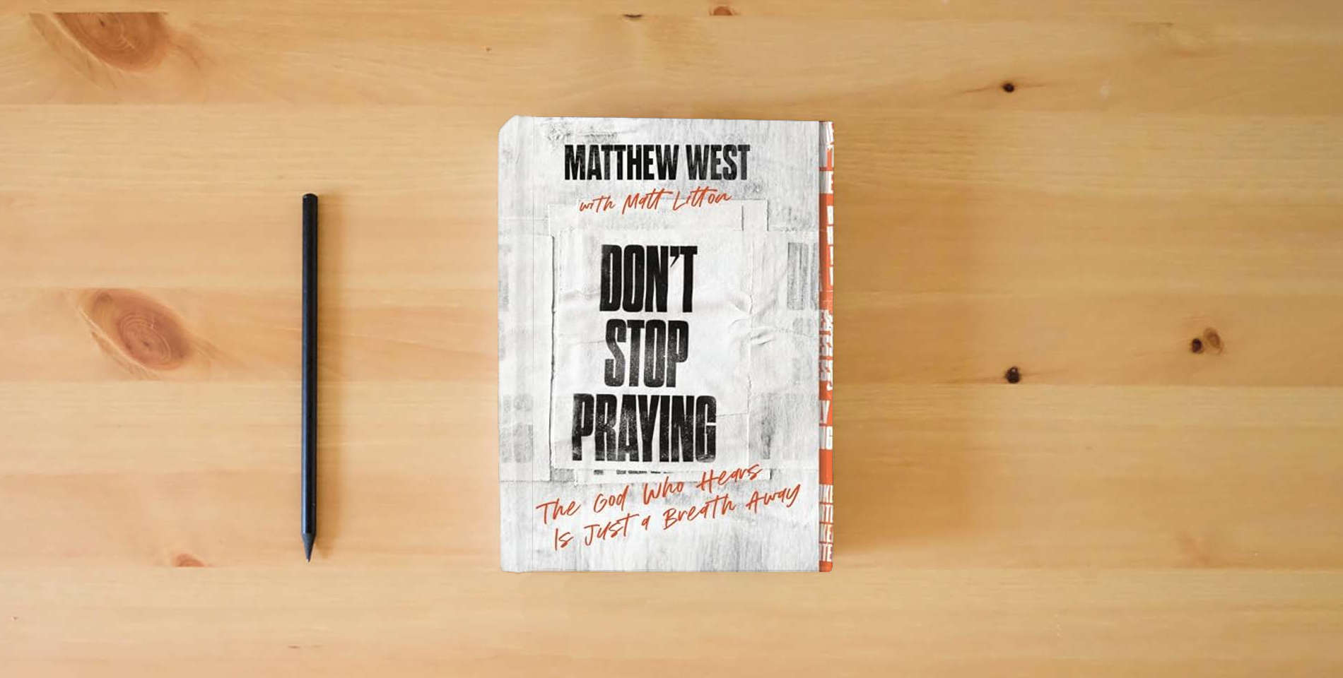 The book Don't Stop Praying: The God Who Hears Is Just a Breath Away (A 40 Day Prayer Journey) is on the table