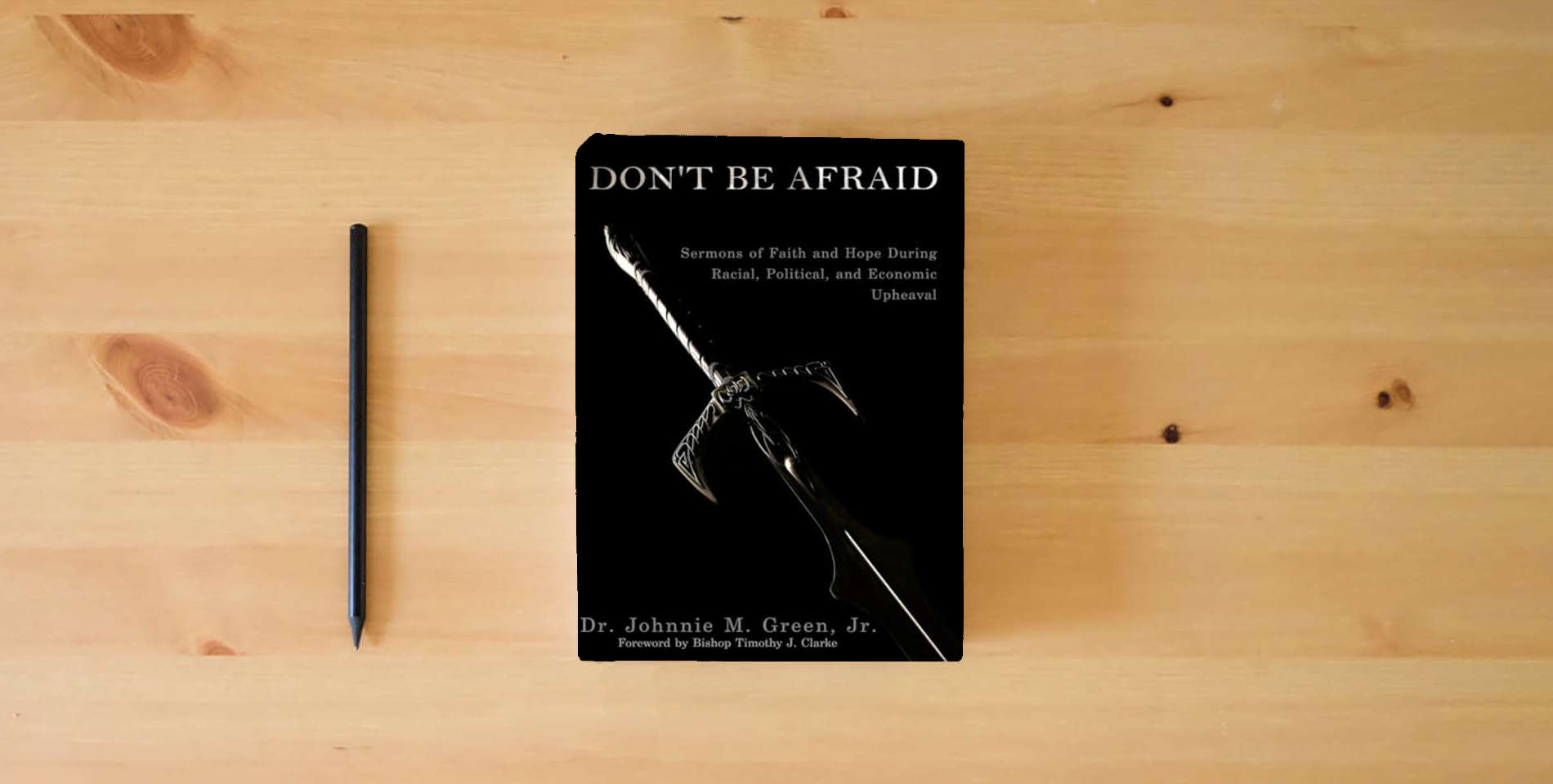 The book Don't Be Afraid is on the table