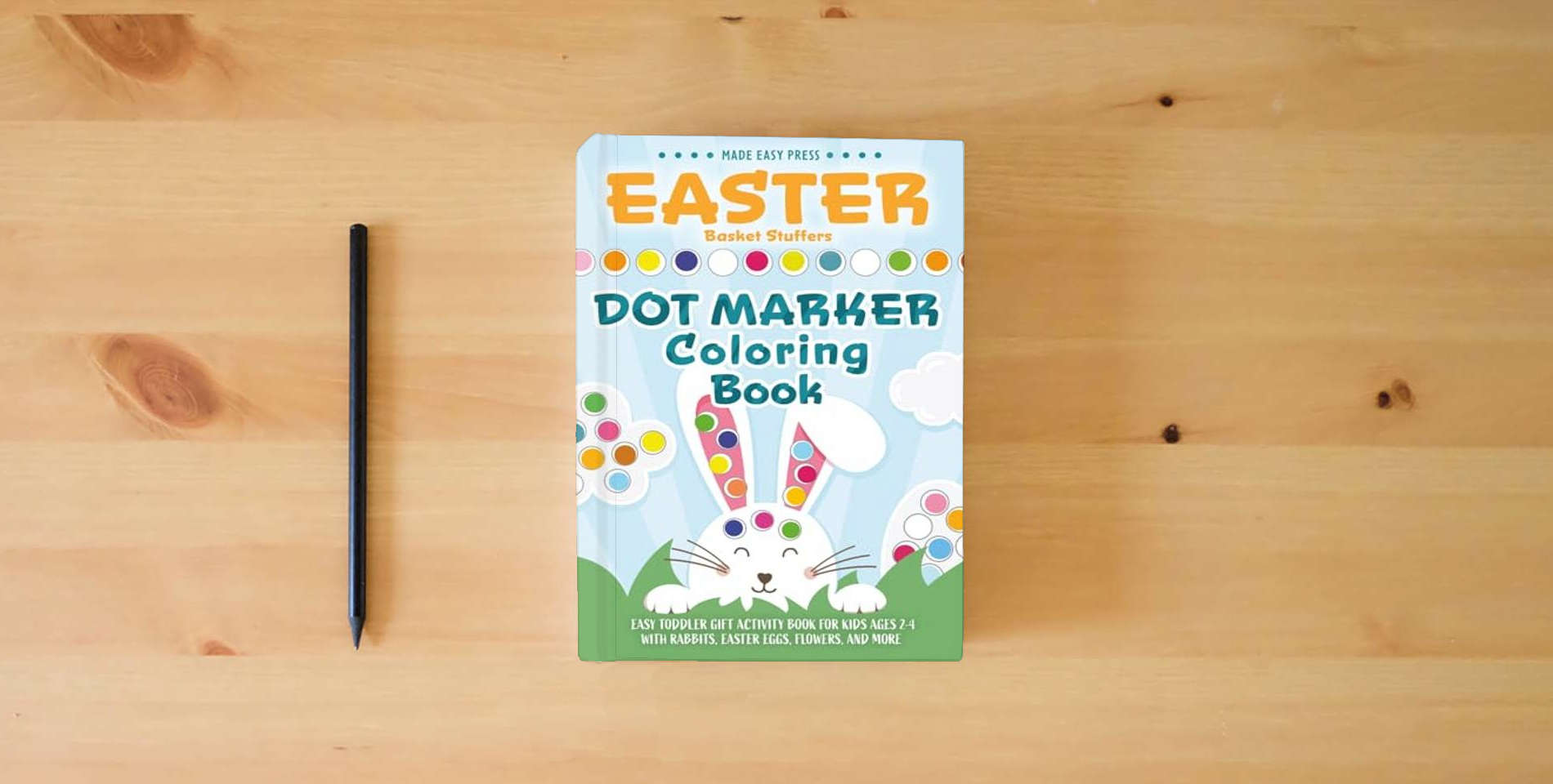 The book Easter Basket Stuffers Dot Marker Coloring Book: Easy Toddler Gift Activity Book for Kids Ages 2-4 With Rabbits, Easter Eggs, Flowers, and More (Easter Gift Ideas for Boys and Girls) is on the table