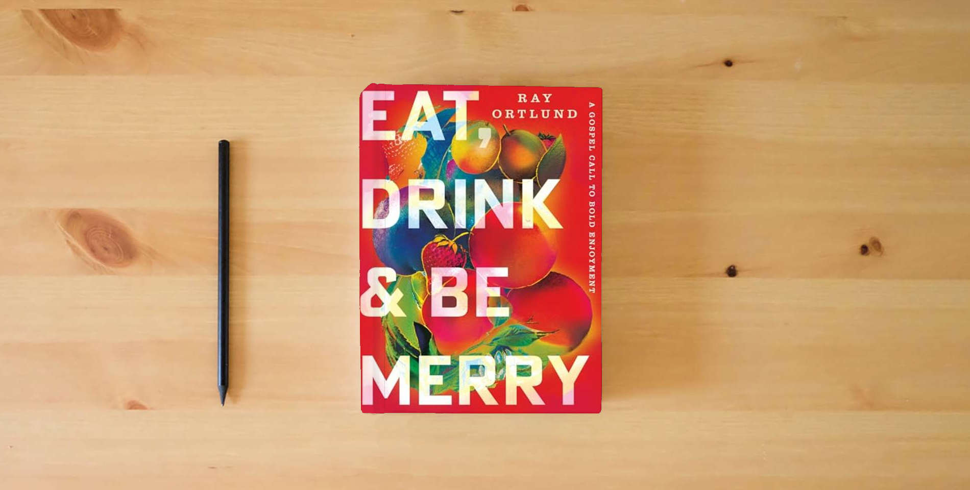 The book Eat, Drink, and Be Merry: A Gospel Call to Bold Enjoyment is on the table