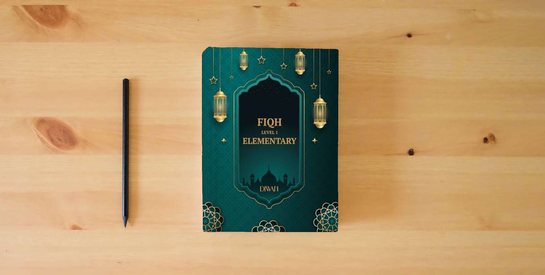 The book Elementary Fiqh is on the table