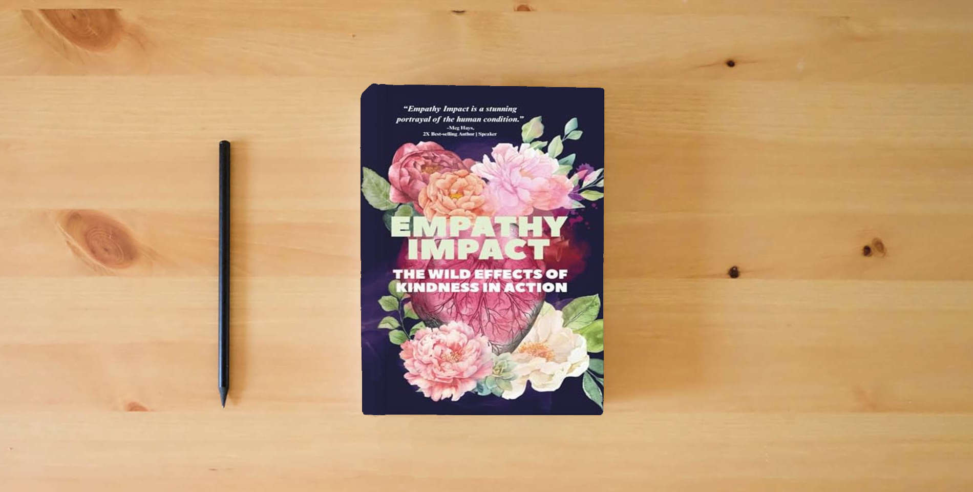 The book Empathy Impact: The Wild Effects of Kindness in Action is on the table