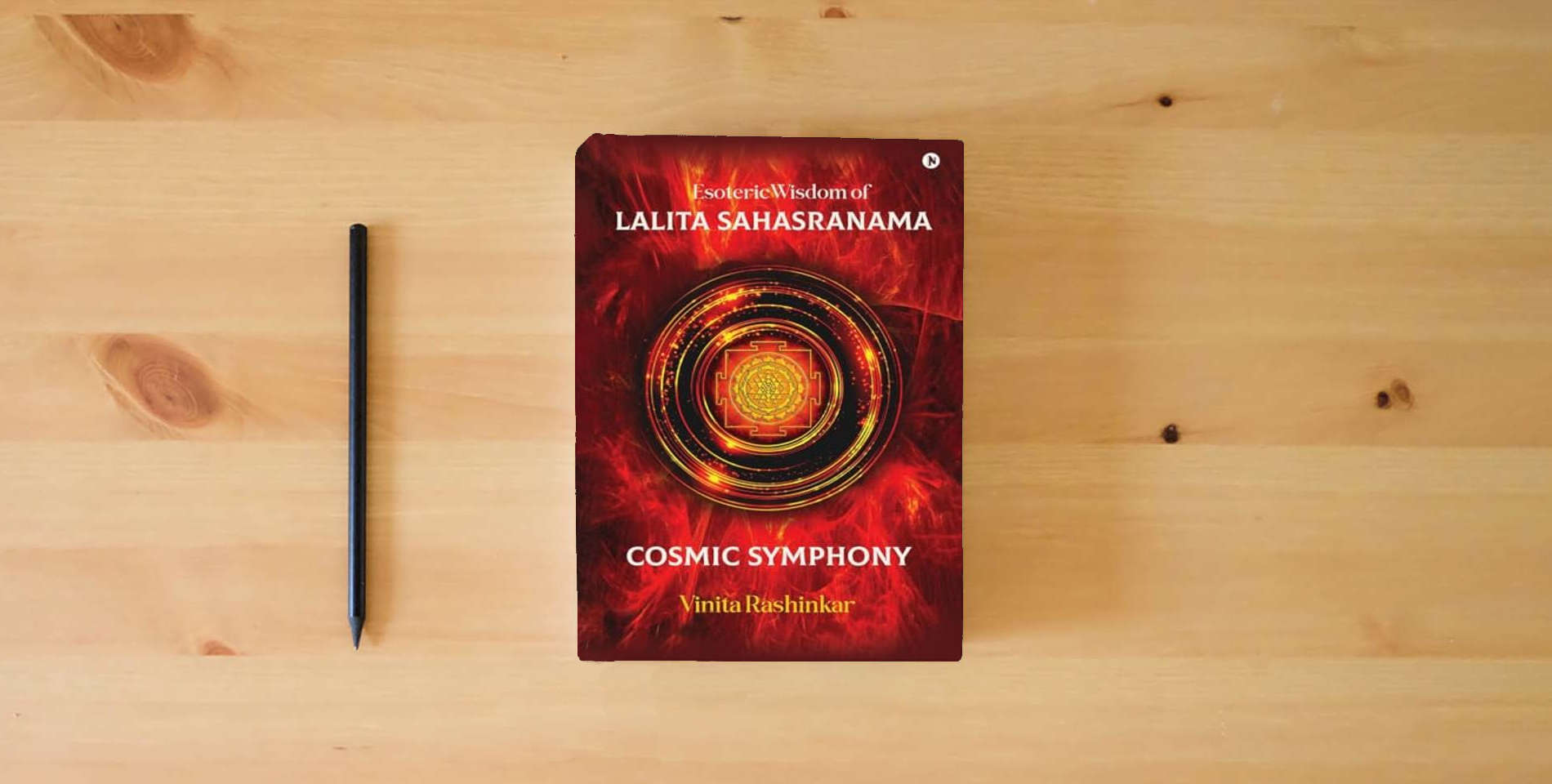 The book Esoteric Wisdom of Lalita Sahasranama - Cosmic Symphony is on the table