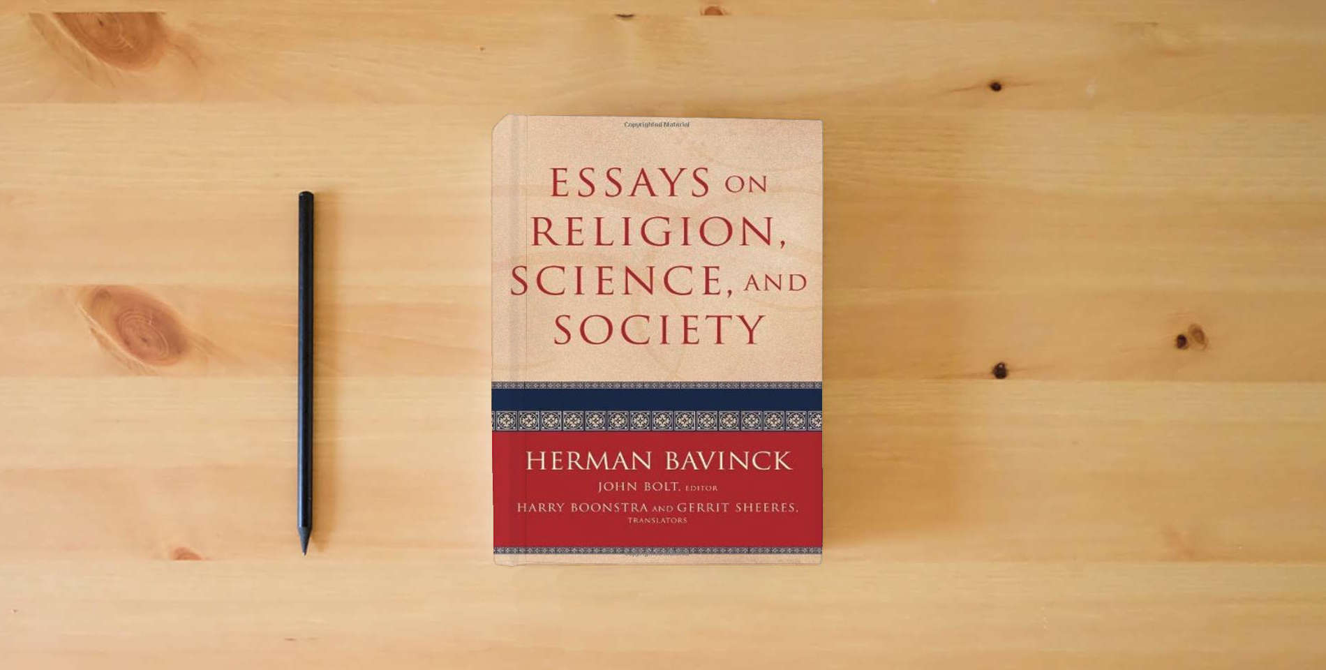 The book Essays on Religion, Science, and Society is on the table