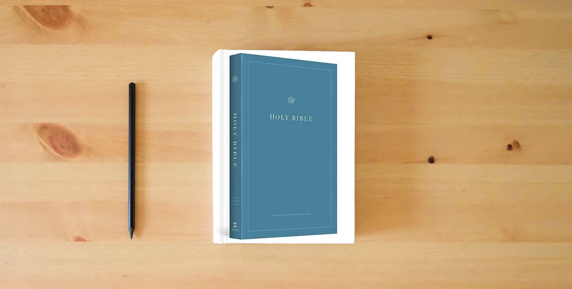 The book ESV Economy Bible (Paperback): Holy Bible, English Standard Version is on the table