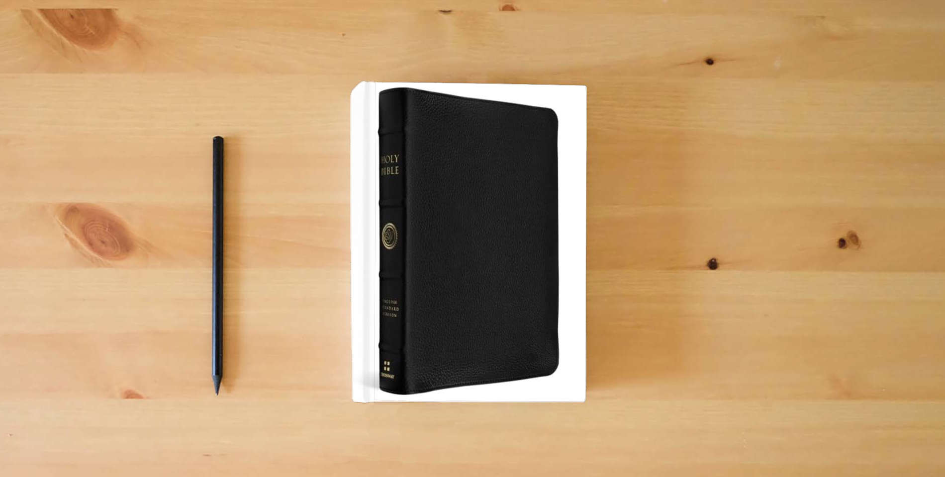 The book ESV Heirloom Bible, Gratia: Large Print Thinline Reference Edition (Goatskin, Black) is on the table