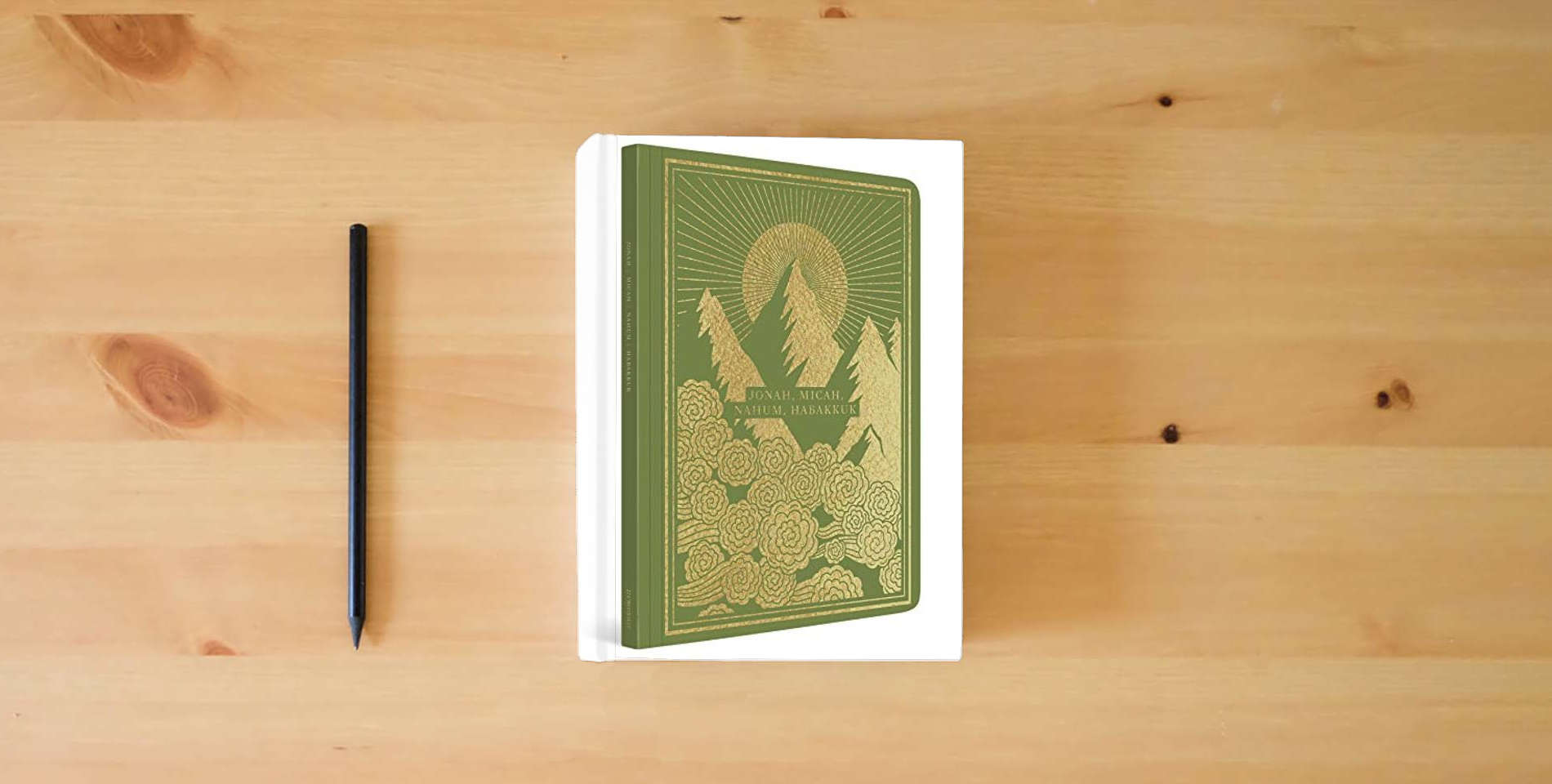The book ESV Illuminated Scripture Journal: Jonah, Micah, Nahum, and Habakkuk is on the table