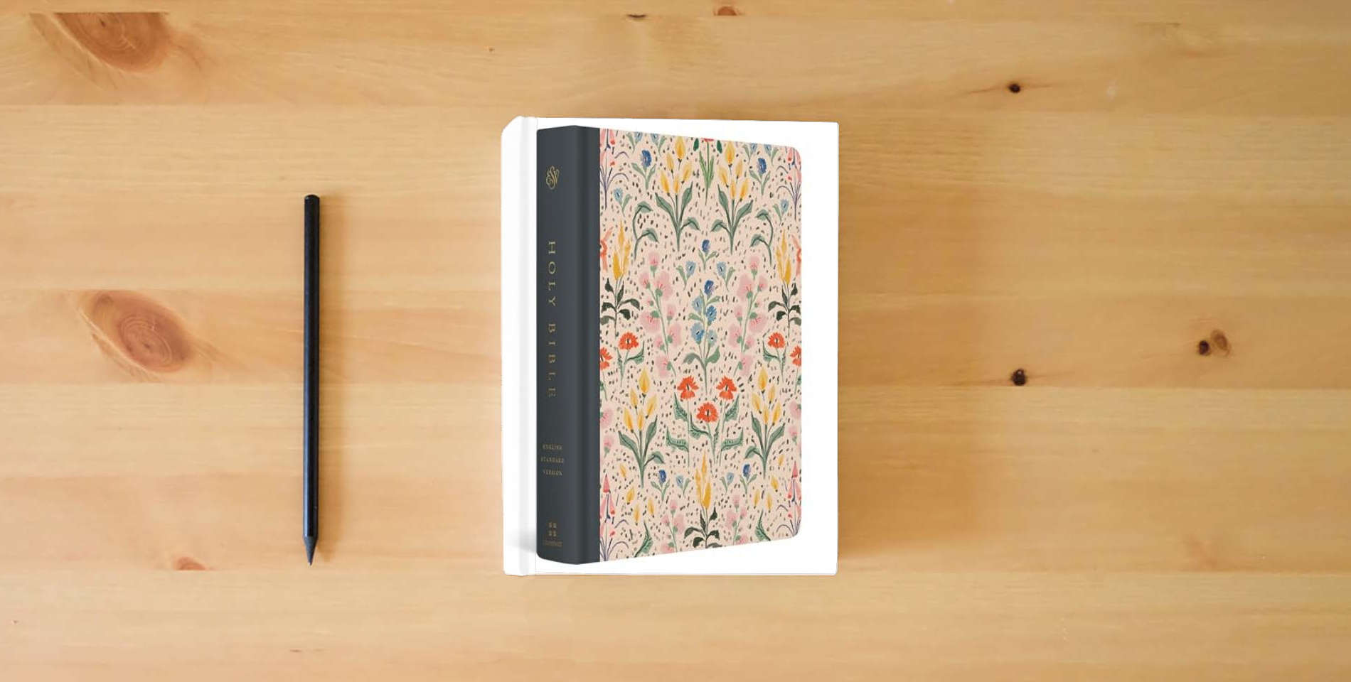 The book ESV Single Column Journaling Bible, Artist Series (Cloth over Board, Lulie Wallace, In Bloom): Holy Bible, English Standard Version is on the table