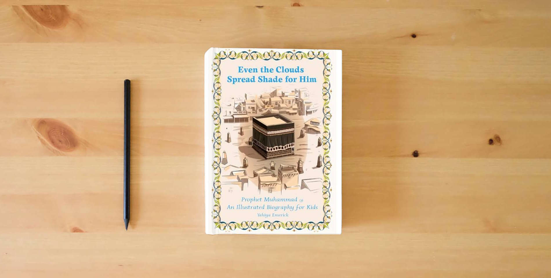 The book Even the Clouds Spread Shade for Him: Expanded Textbook Edition is on the table