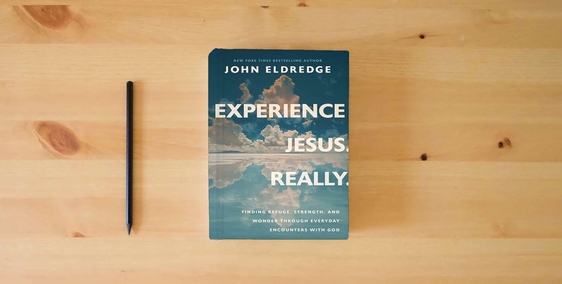 The book Experience Jesus. Really: Finding Refuge, Strength, and Wonder through Everyday Encounters with God is on the table