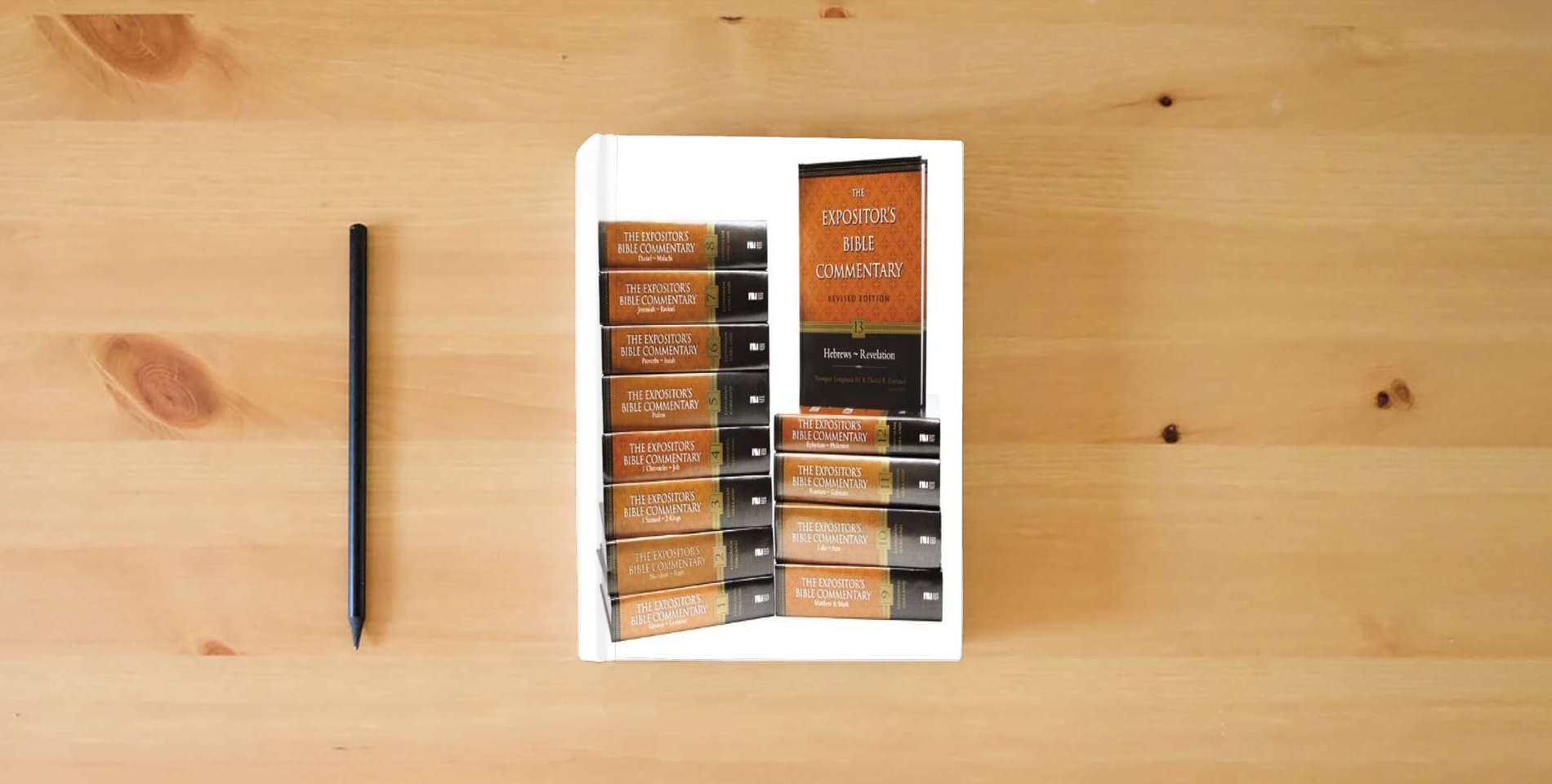 The book Expositor's Bible Commentary---Revised: 13-Volume Complete Set (Expositor's Bible Commentary, The) is on the table