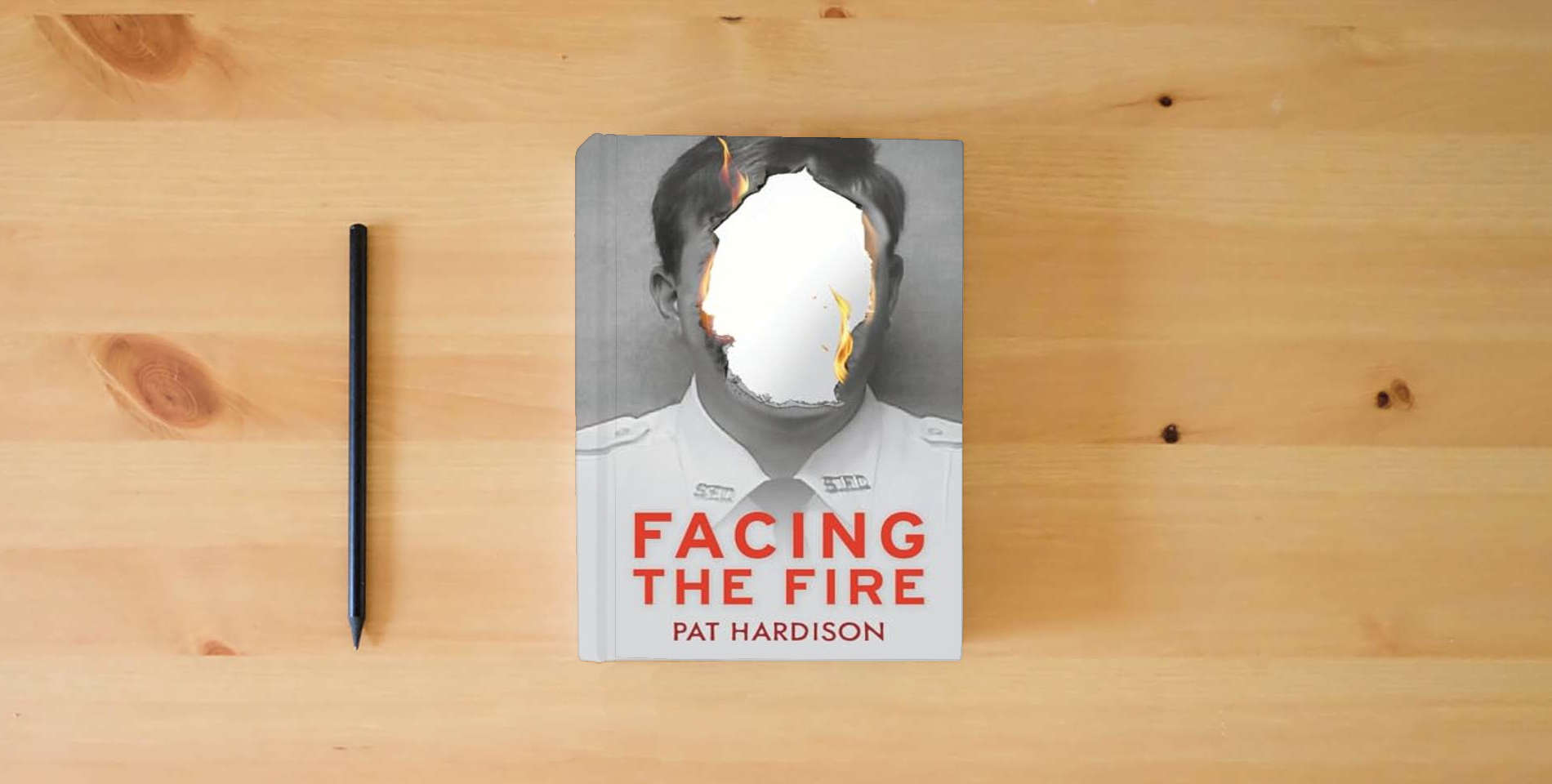 The book Facing the Fire is on the table