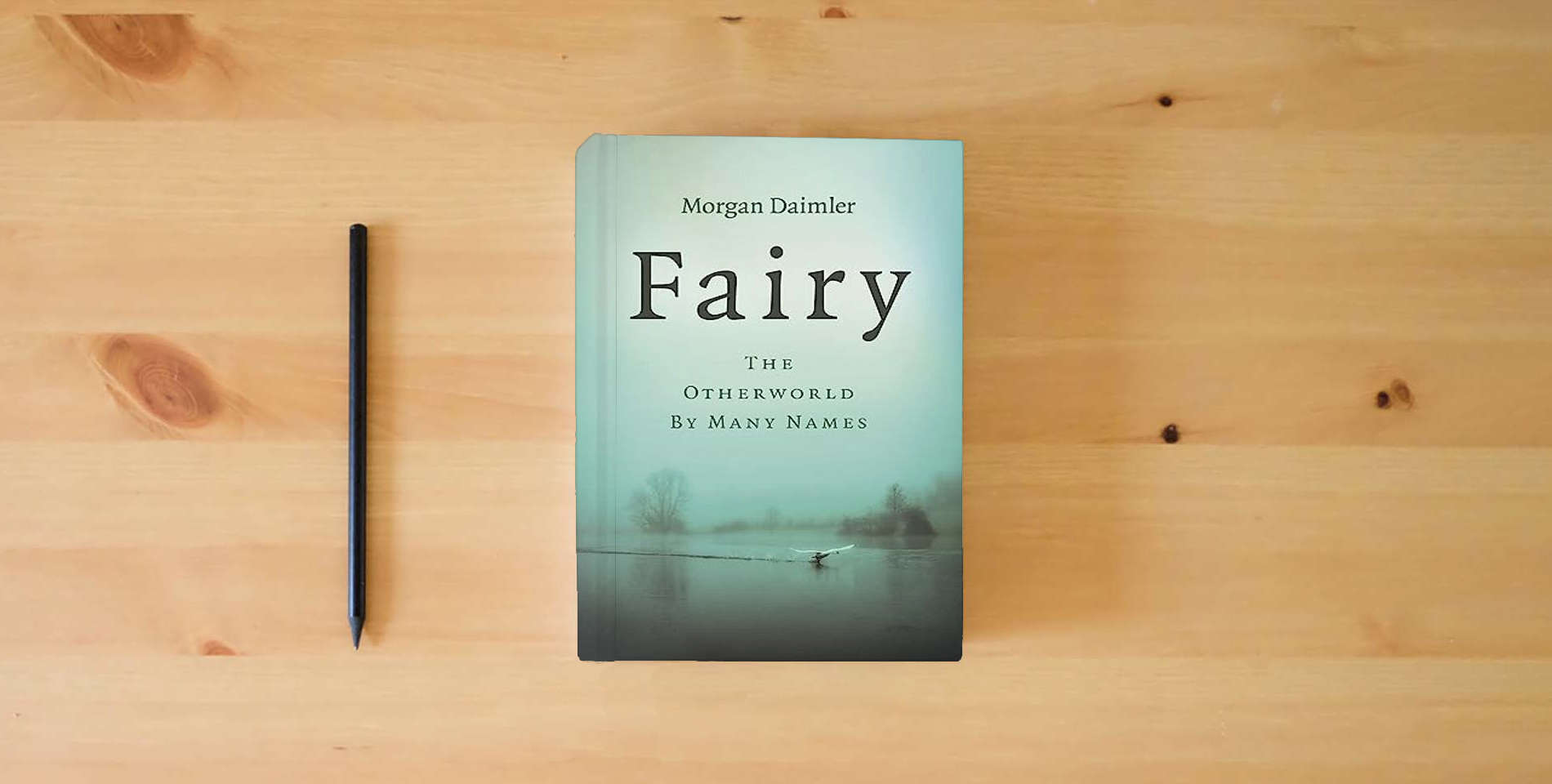 The book Fairy: The Otherworld by Many Names is on the table