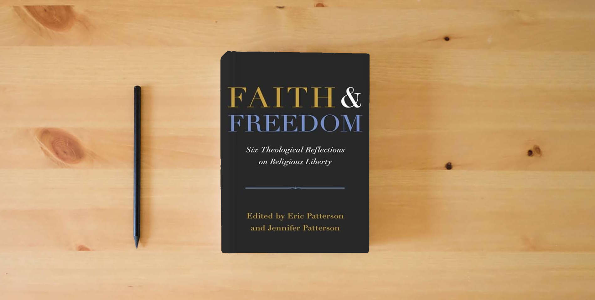 The book Faith and Freedom: Six Theological Reflections on Religious Liberty is on the table