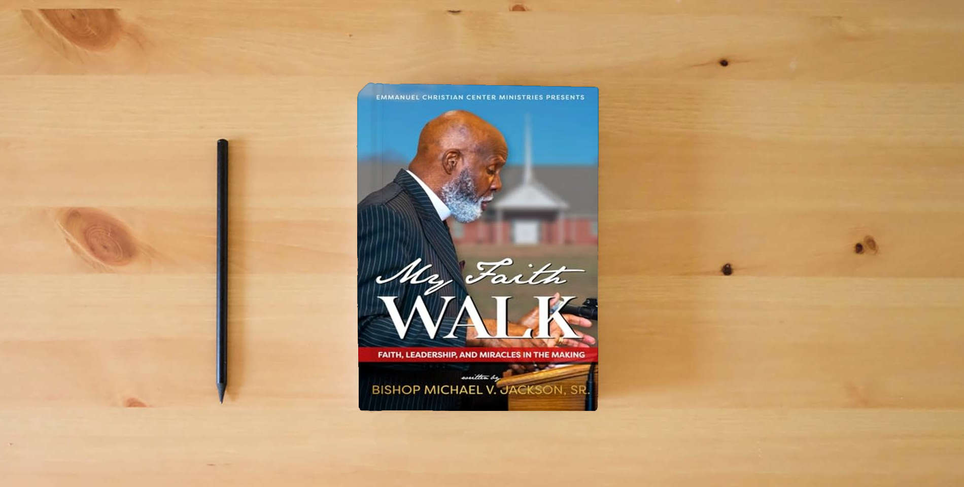 The book My Faith Walk: Faith, Leadership, and Miracles in the Making is on the table