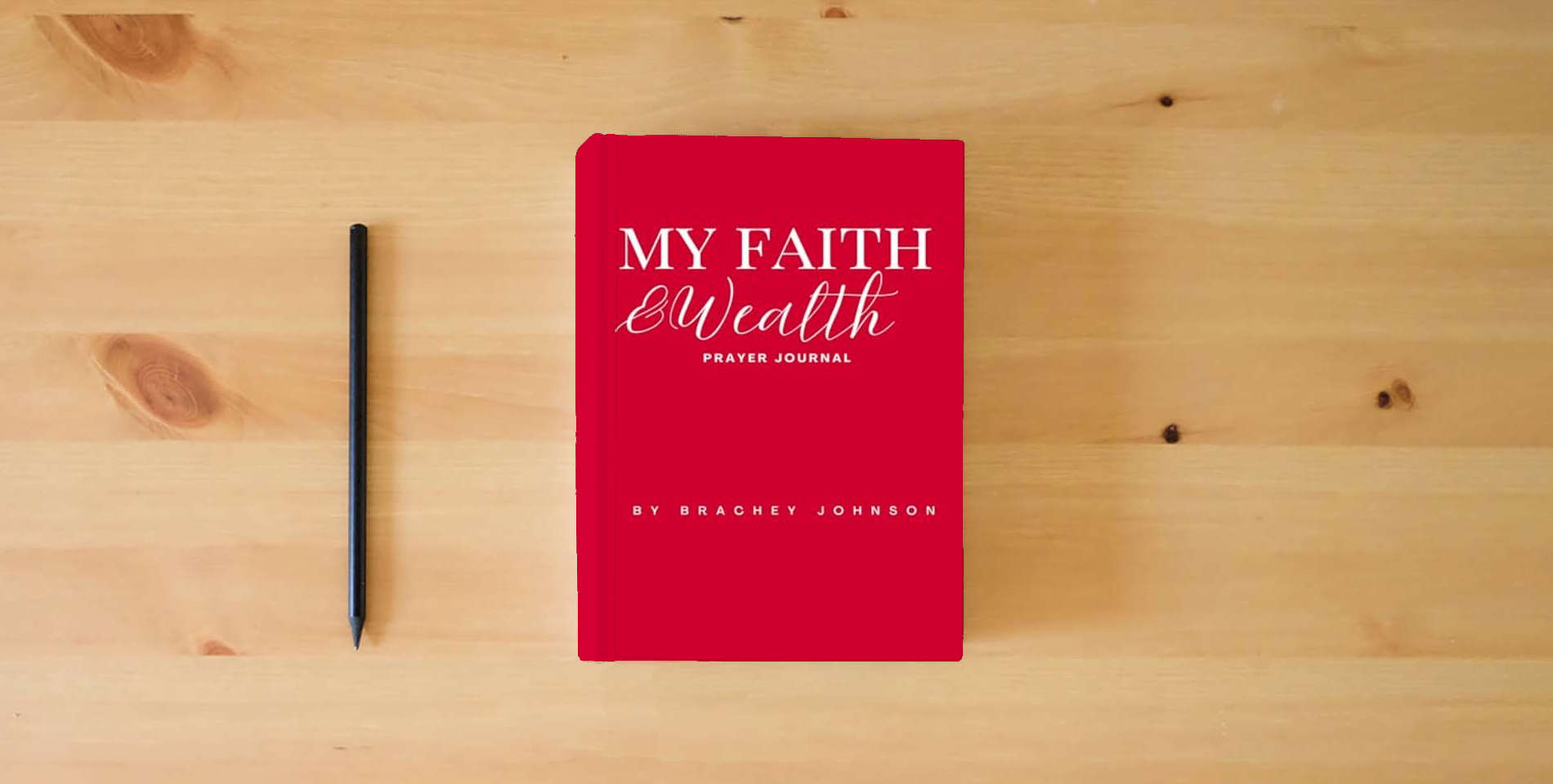 The book My Faith & Wealth Prayer Journal is on the table