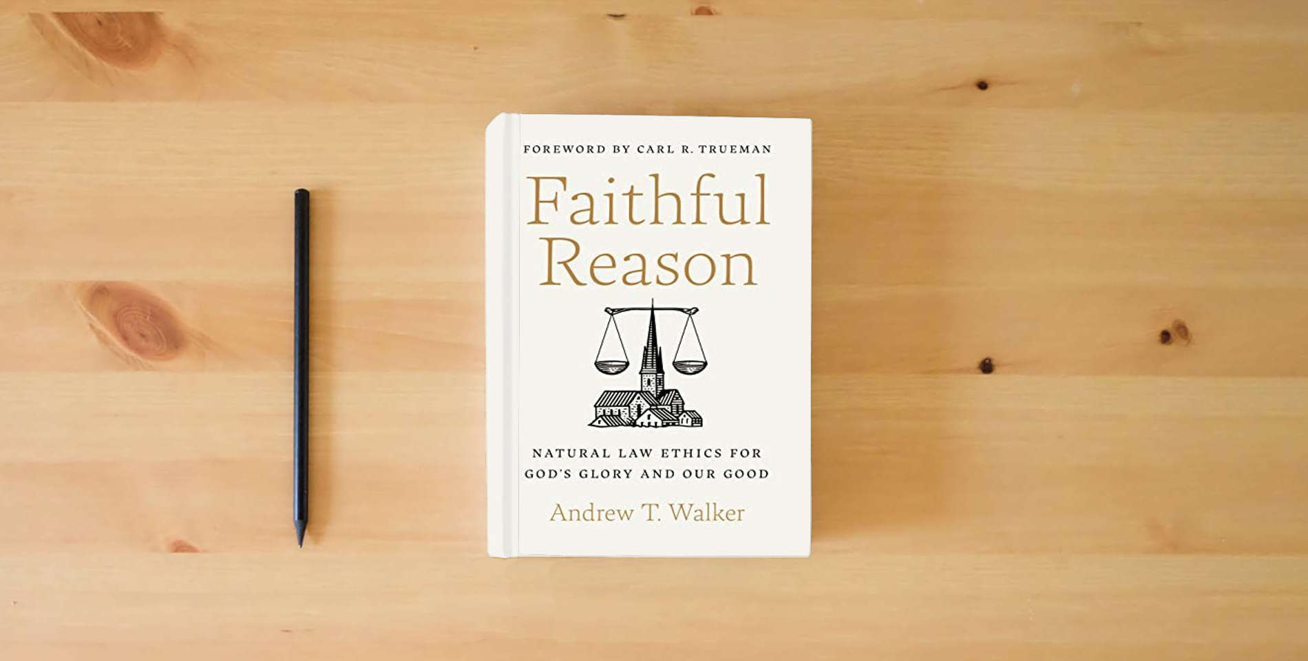 The book Faithful Reason: Natural Law Ethics for God’s Glory and Our Good is on the table