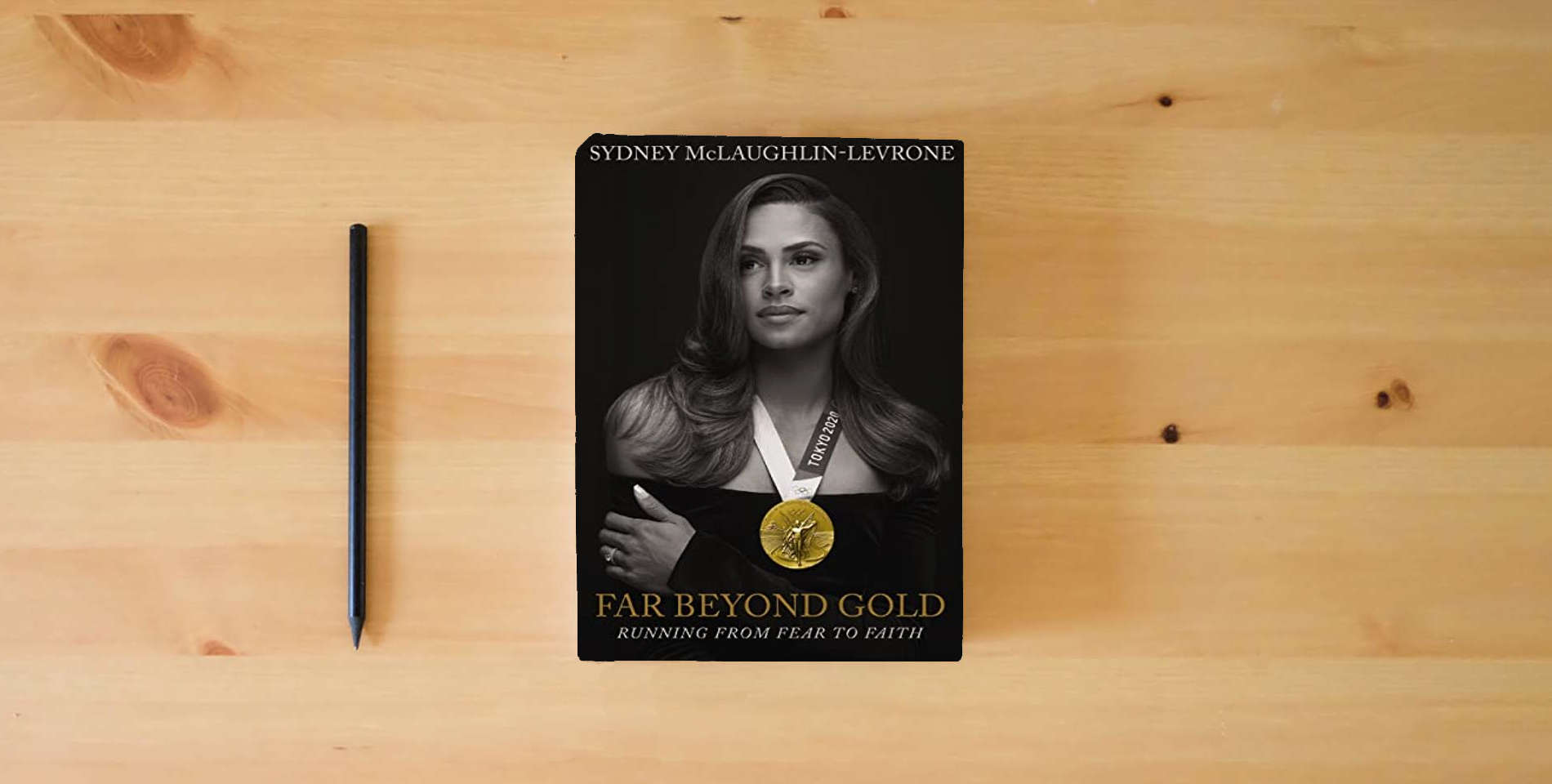 The book Far Beyond Gold: Running from Fear to Faith is on the table