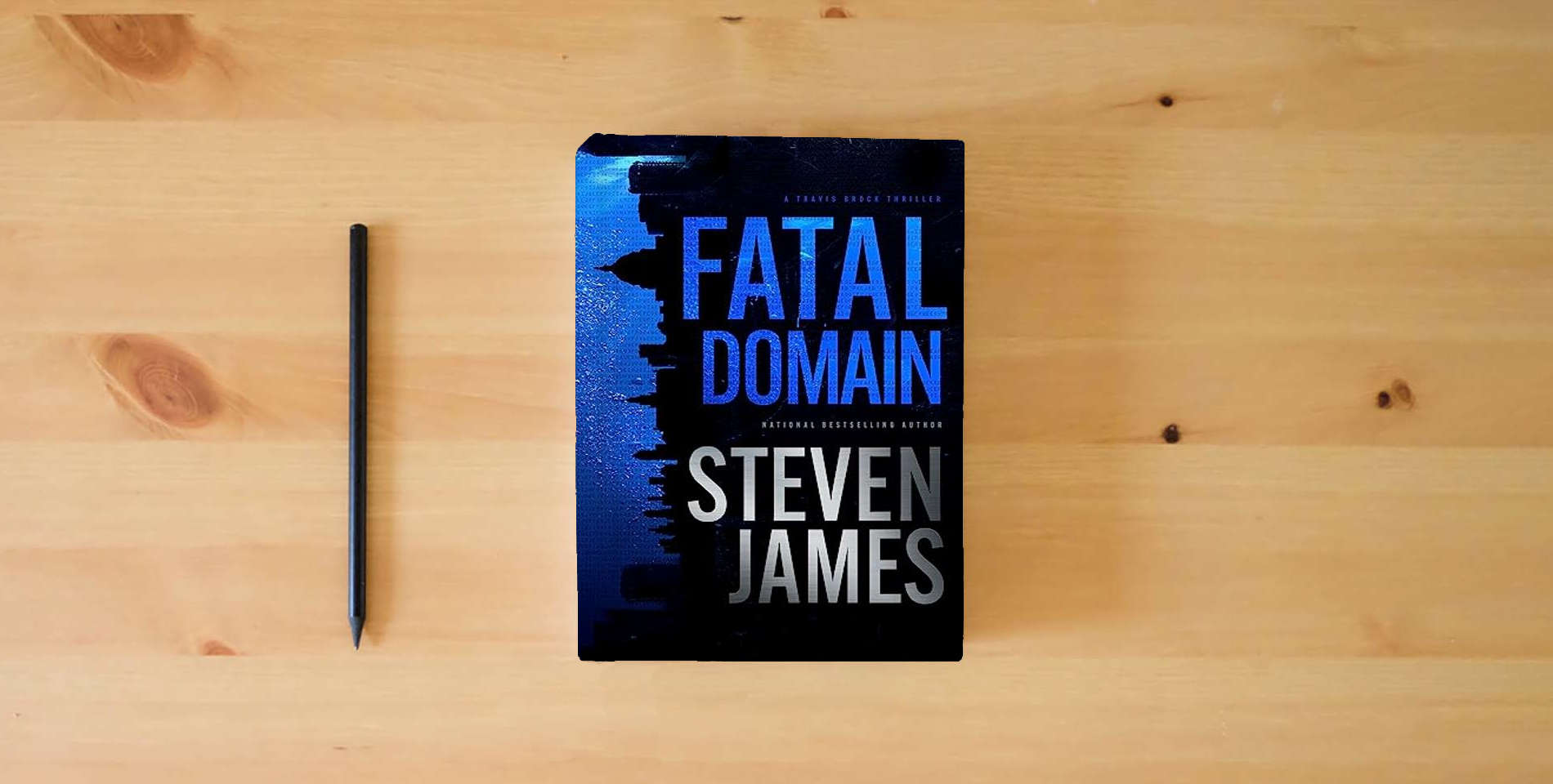 The book Fatal Domain is on the table