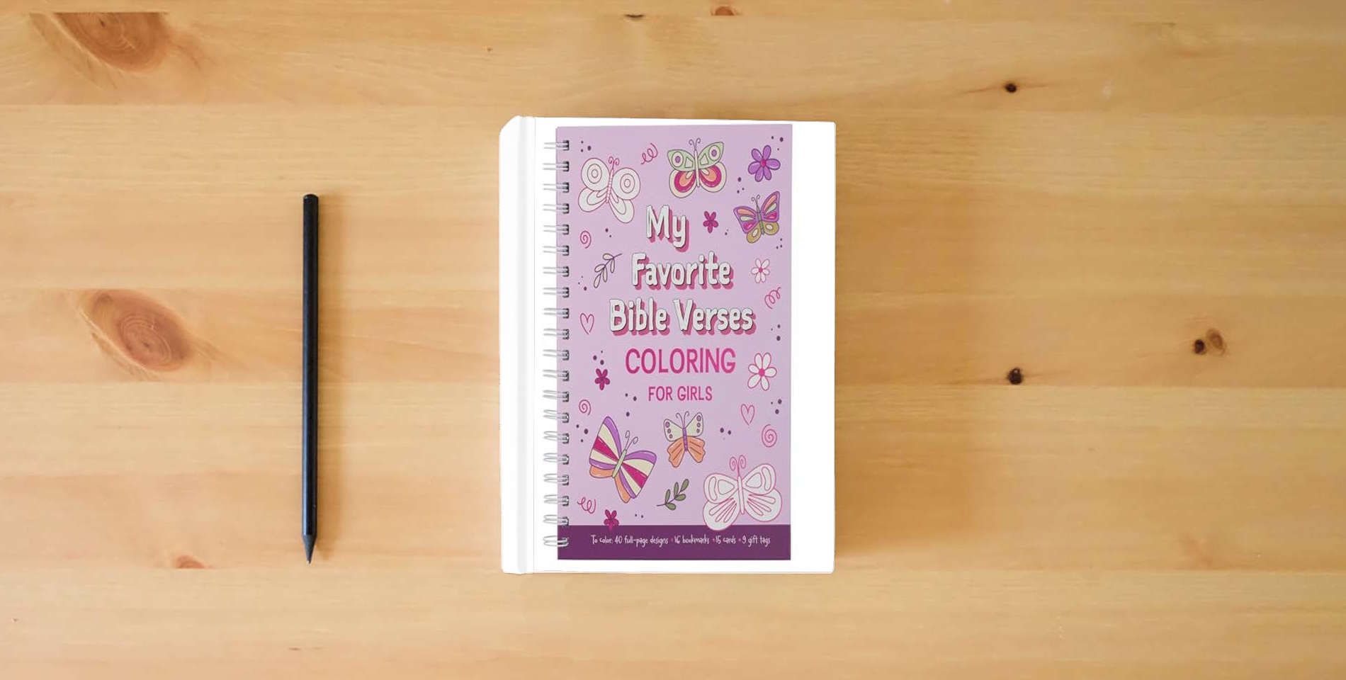 The book My Favorite Bible Verses Coloring for Girls, Ages 8-12 is on the table